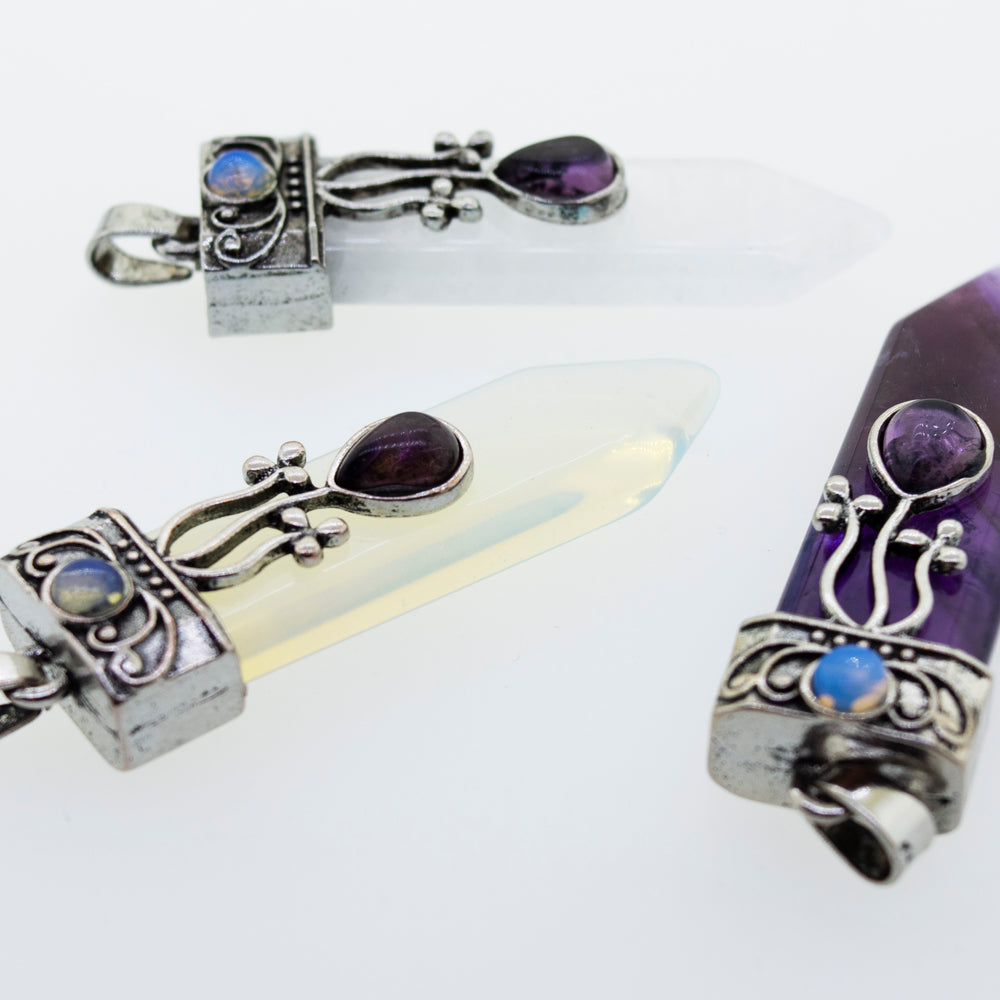 Super Silver's Obelisk Crystal Stone Pendant features boho and silver-plated designs.