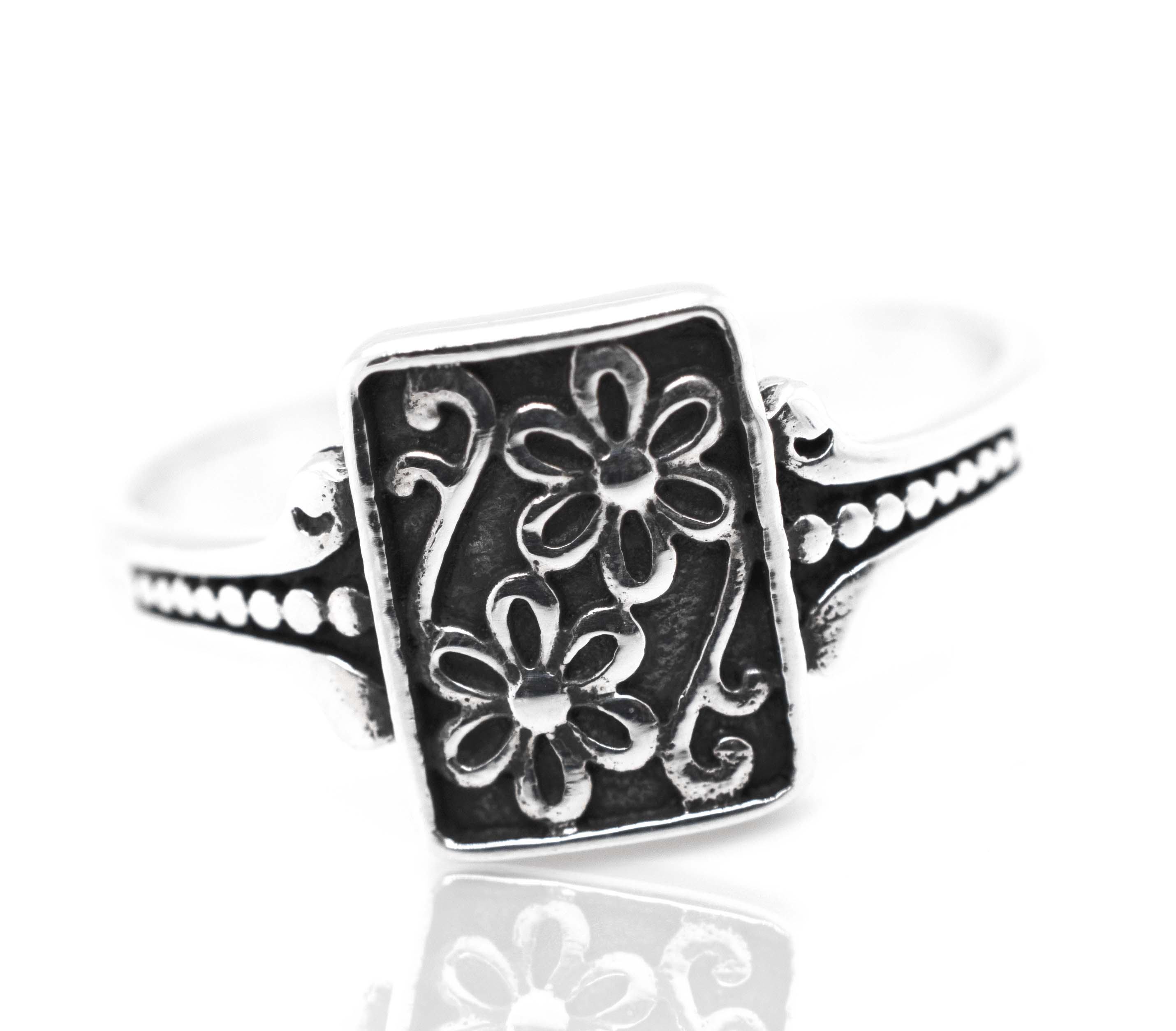 A Shield With Flower Pattern ring.