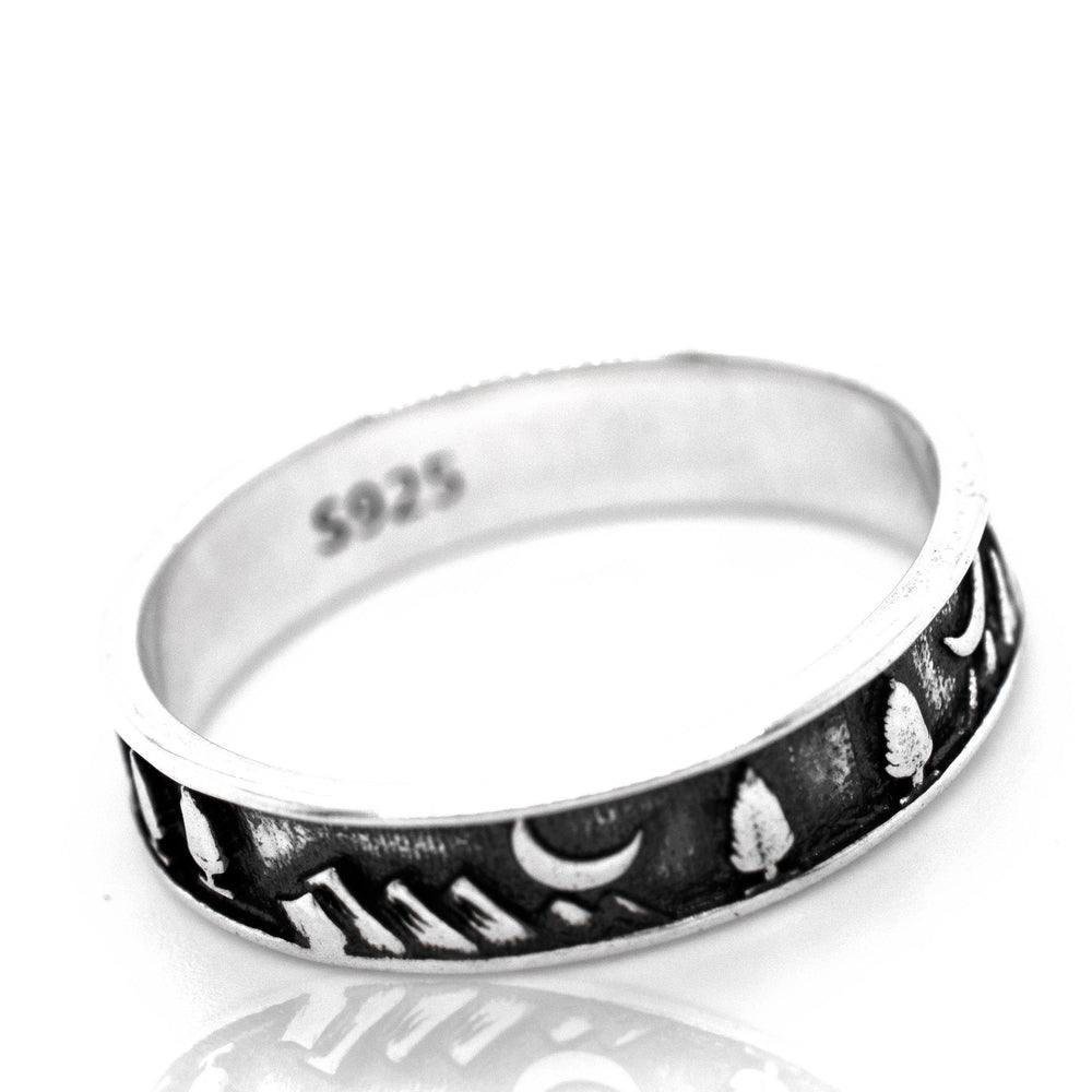 A silver Night Sky Forest Scene Band with intricate black and white tree designs.