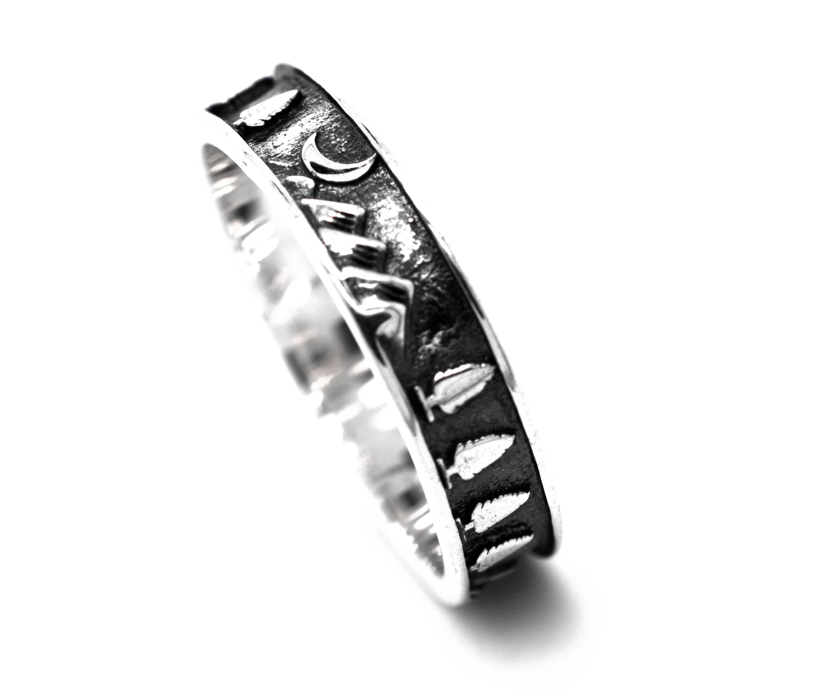 A Night Sky Forest Scene Band with a skull and crossbones design.