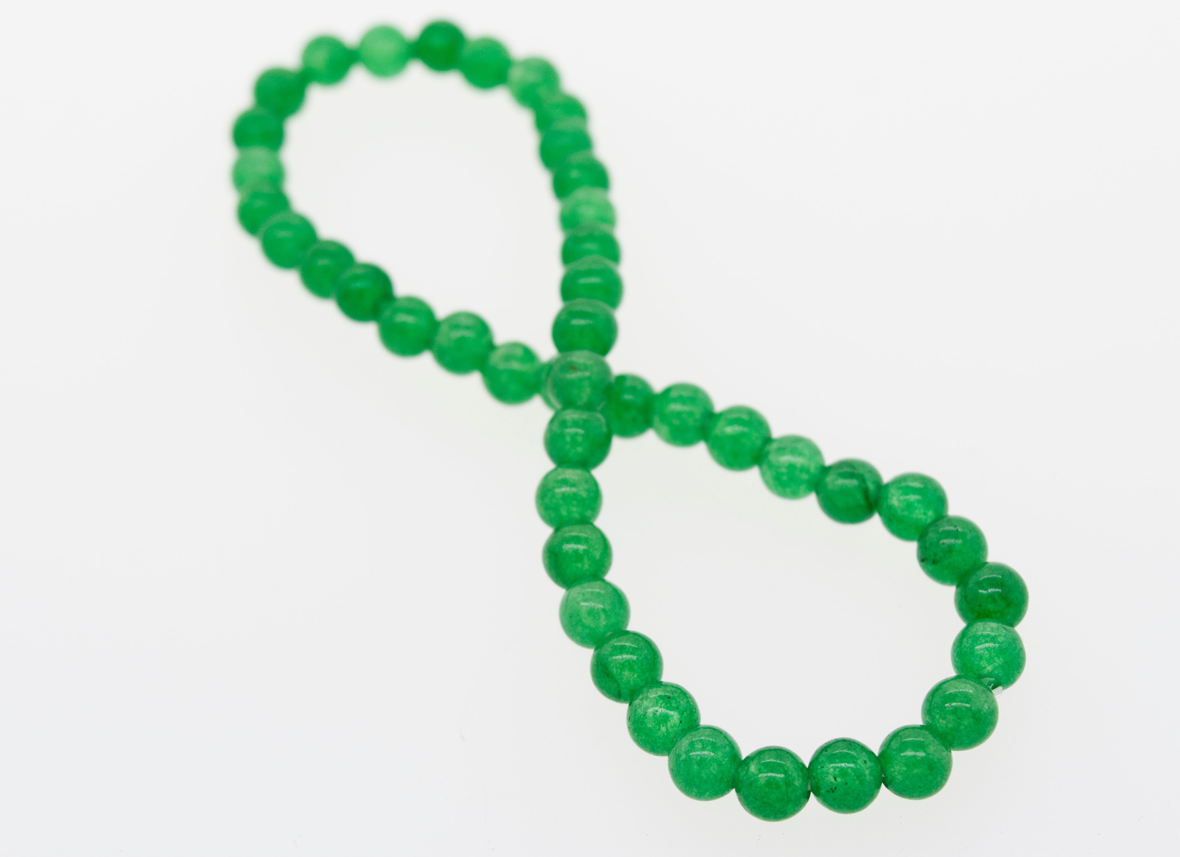 A Small Stone Beads Bracelet, along with five other gemstones, on a white surface. (Brand: Super Silver)