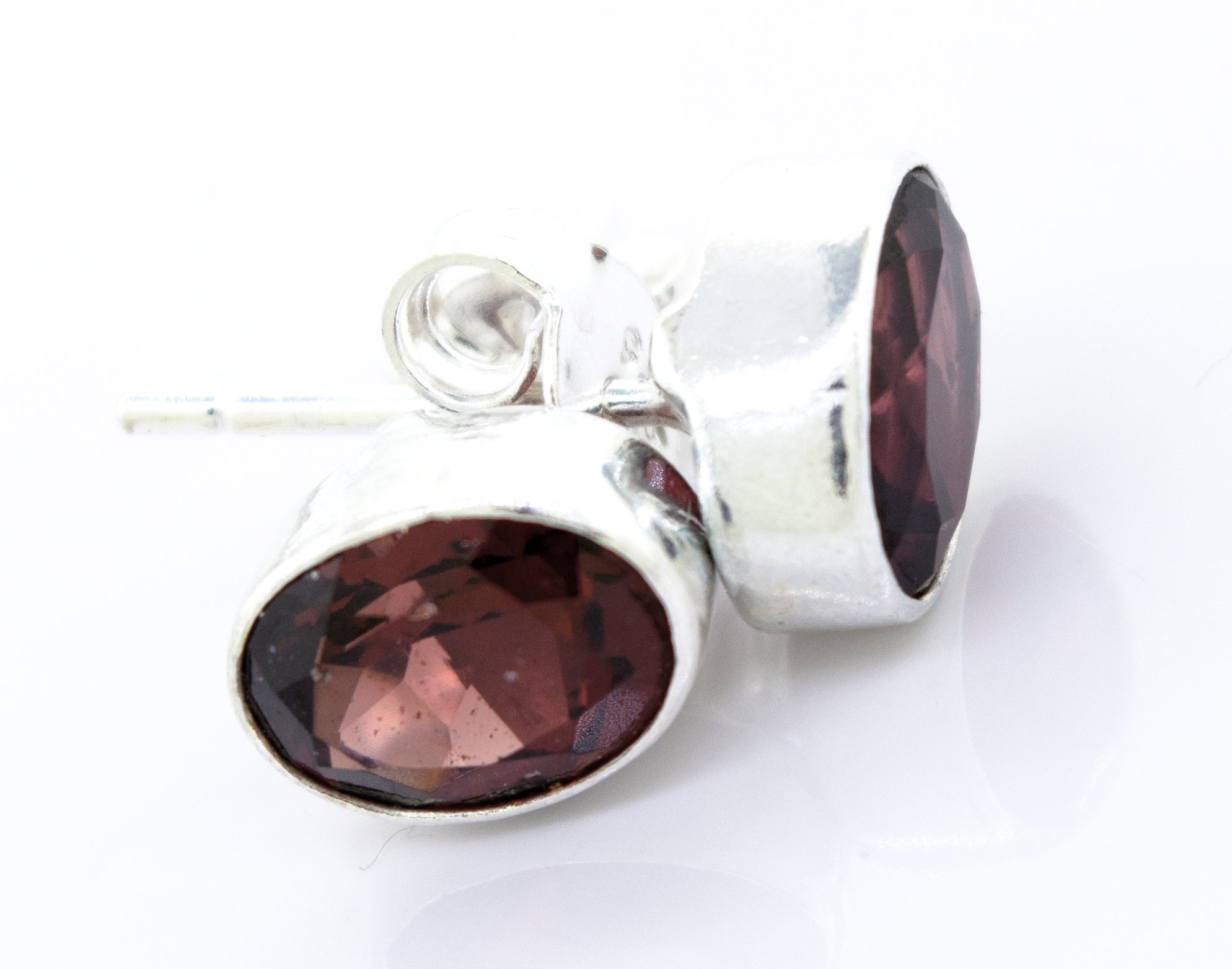 A pair of Super Silver Garnet Studs With Plain Sterling Silver Setting.