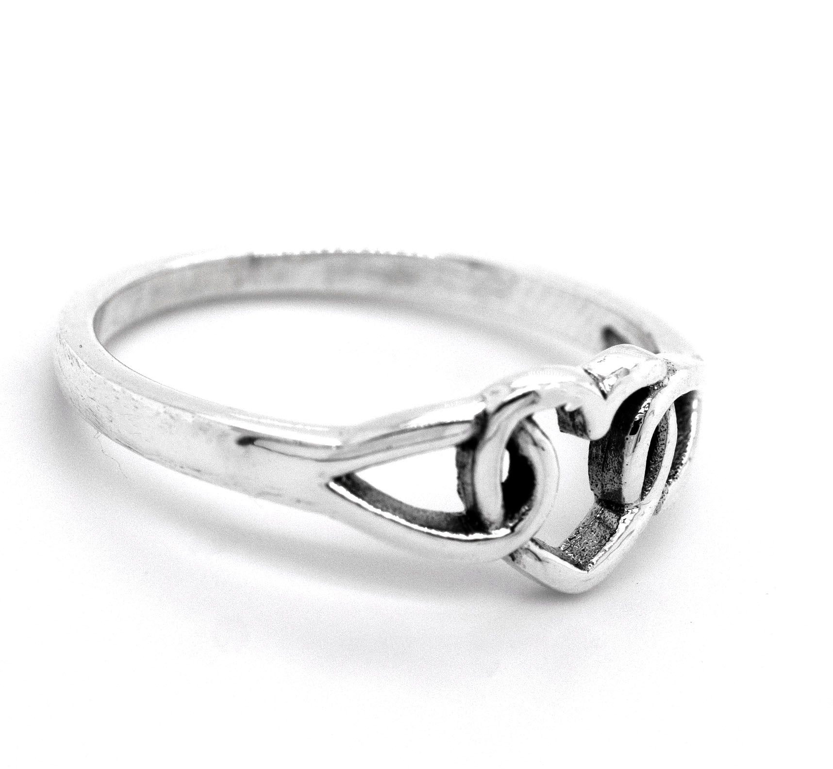 A minimalist Love Knot Heart Ring, made of sterling silver and featuring a heart knot design at the center, symbolizes love.