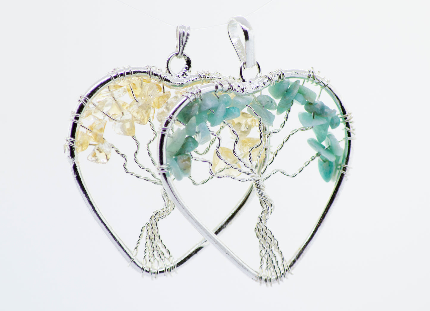 A Super Silver Heart Shaped Tree of Life Pendant featuring a beautiful tree of life design, forming a heart shape.