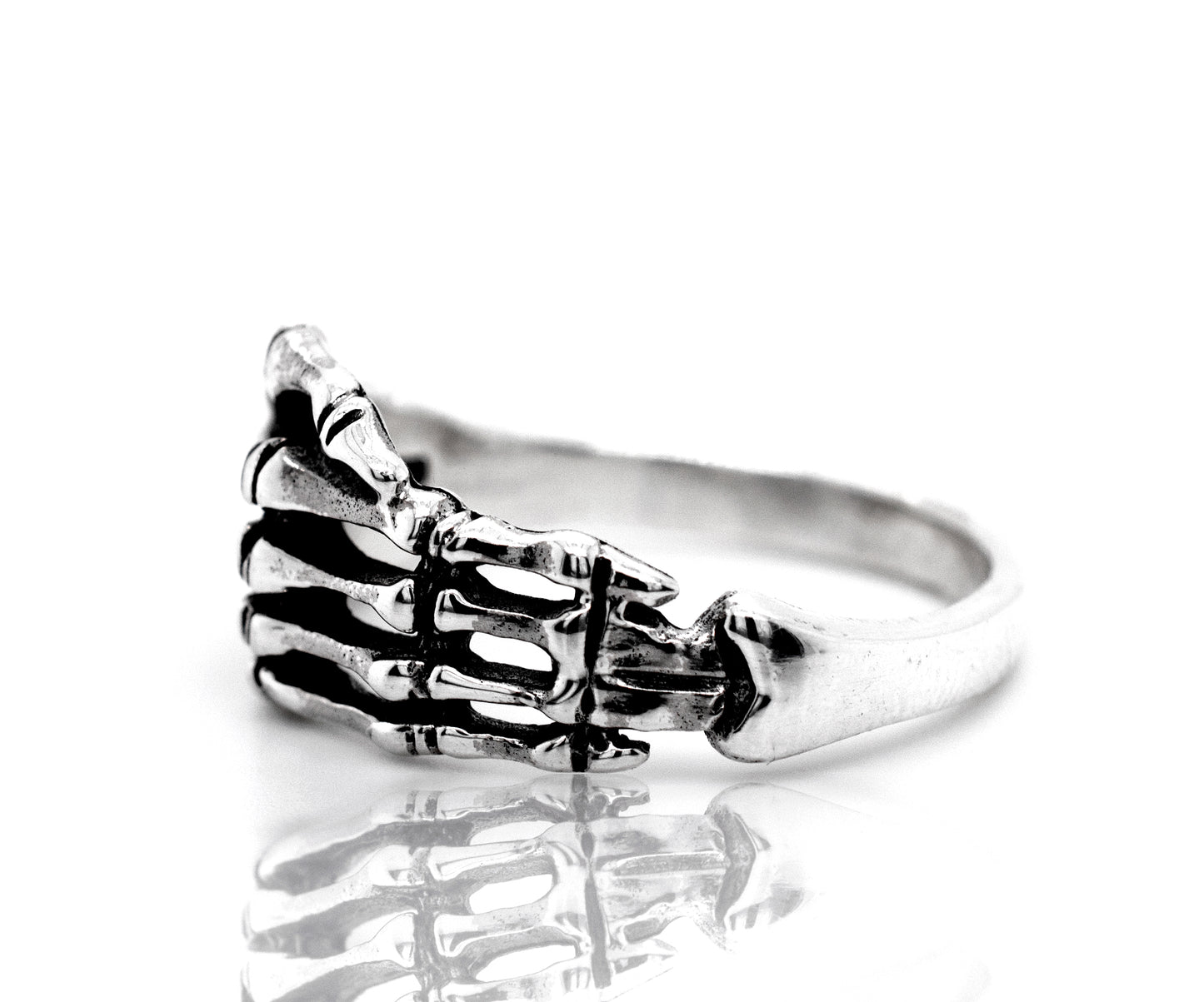 A sterling silver Skeleton Hand Ring with a skeleton hand design.