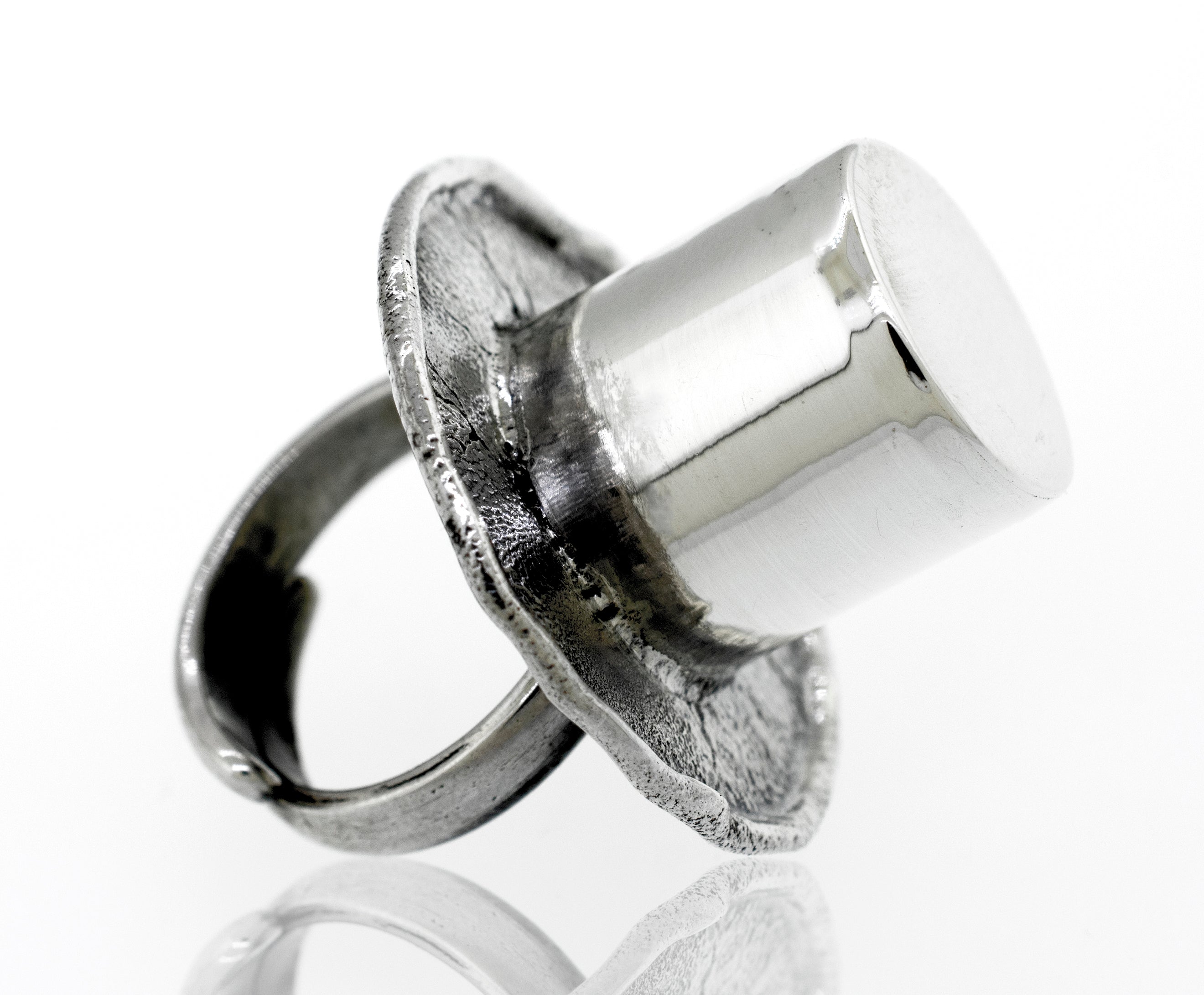 A minimalist Artisans Top Hat adjustable ring.