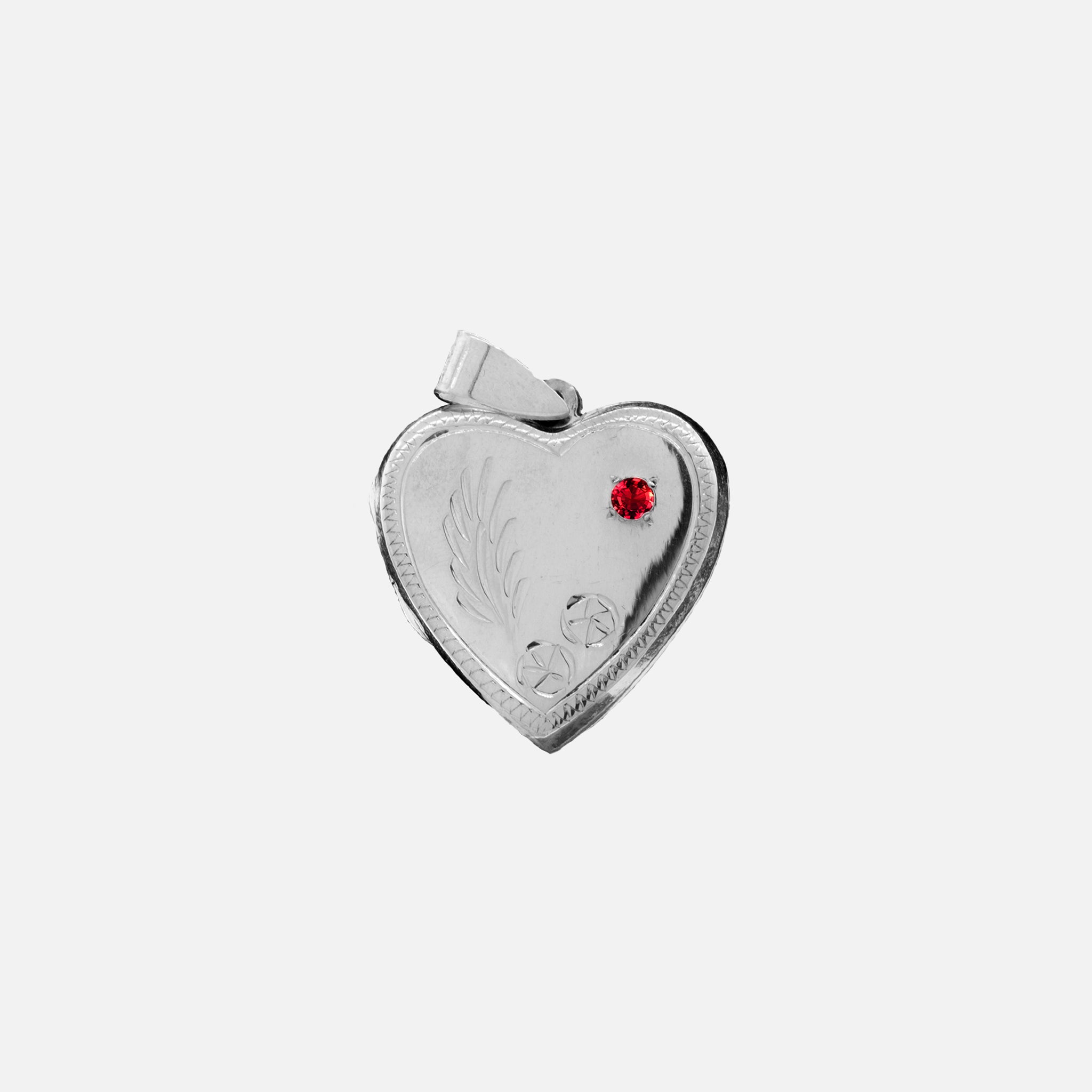 This romantic Heart Shaped Locket with Stone and lacy Etching from Super Silver features a sterling silver design and is adorned with a stunning red stone.