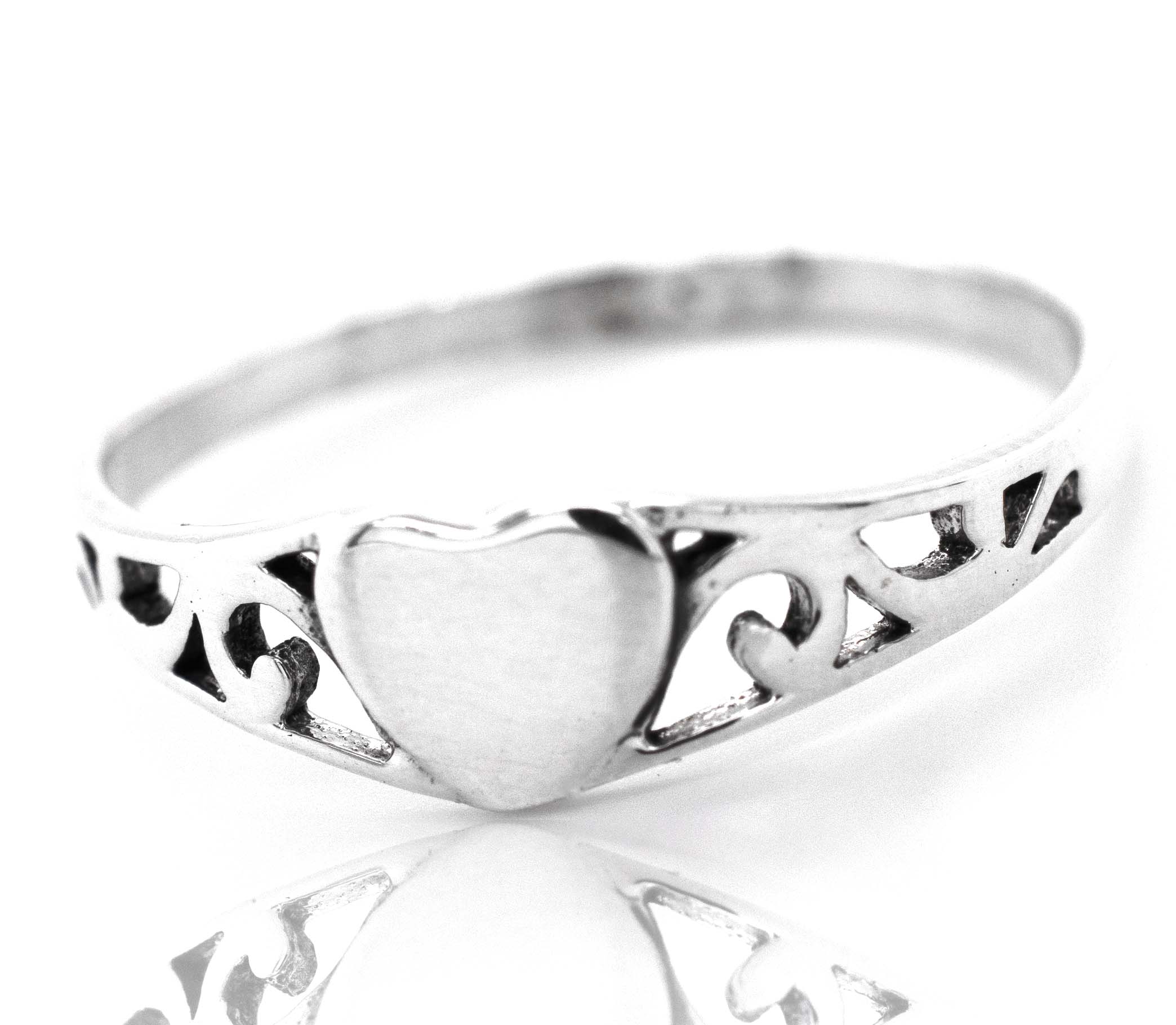 An exquisite sterling silver Heart Ring With Swirl Design adorned with a beautiful heart.