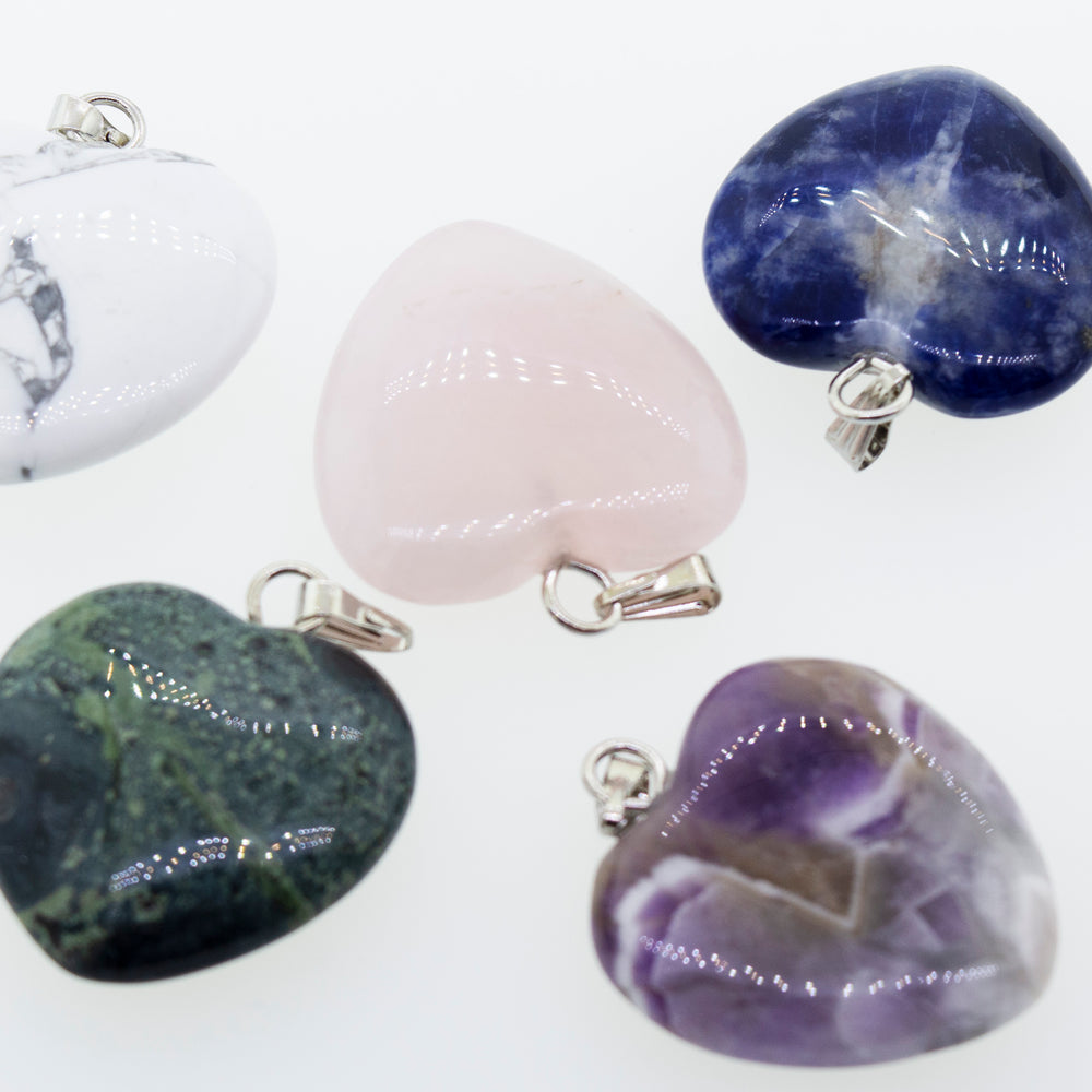 
                  
                    Four Super Silver heart-shaped stone pendants for everyday wear.
                  
                