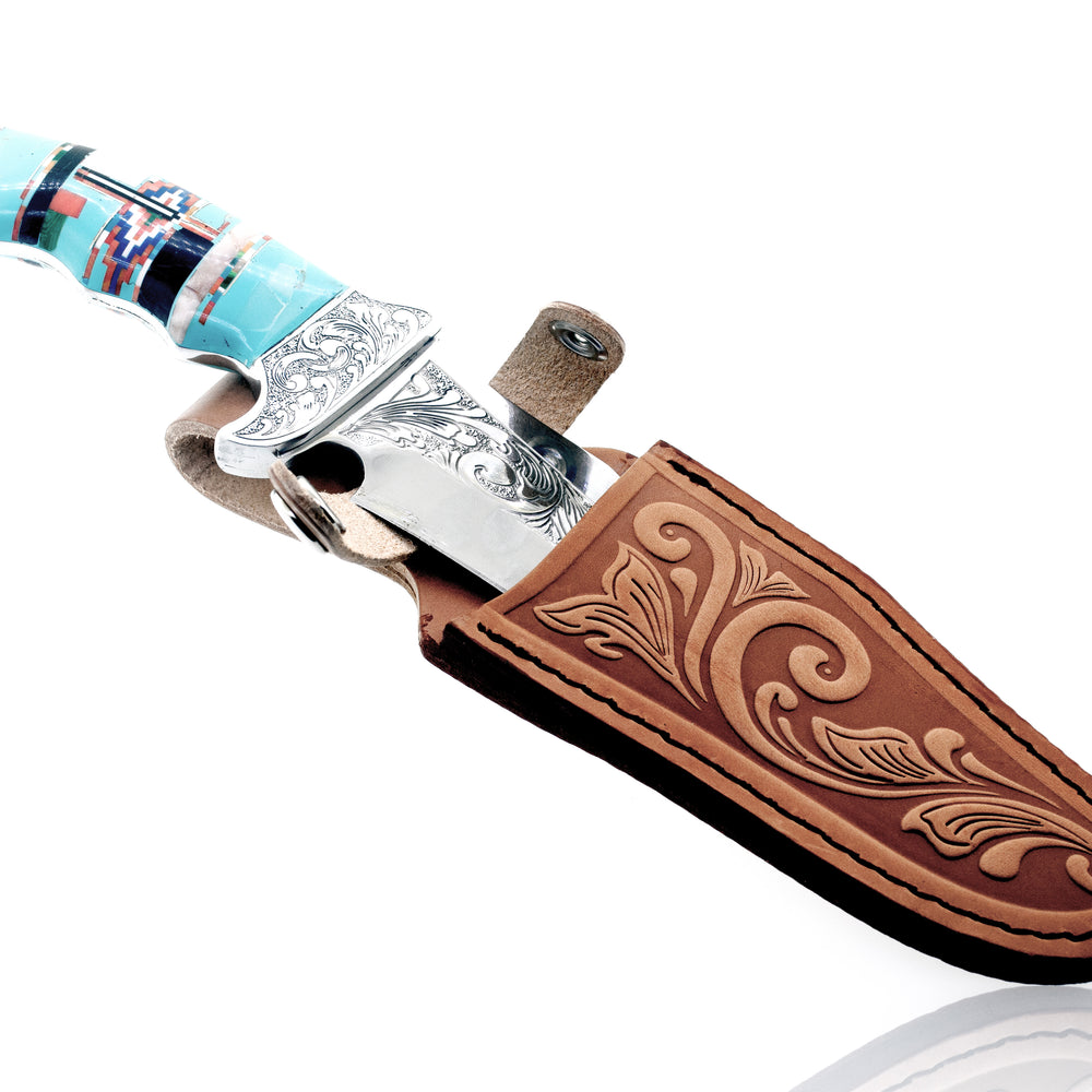A Stunning Handcrafted Knife with an inlaid stone handle and leather sheath featuring a turquoise stone.