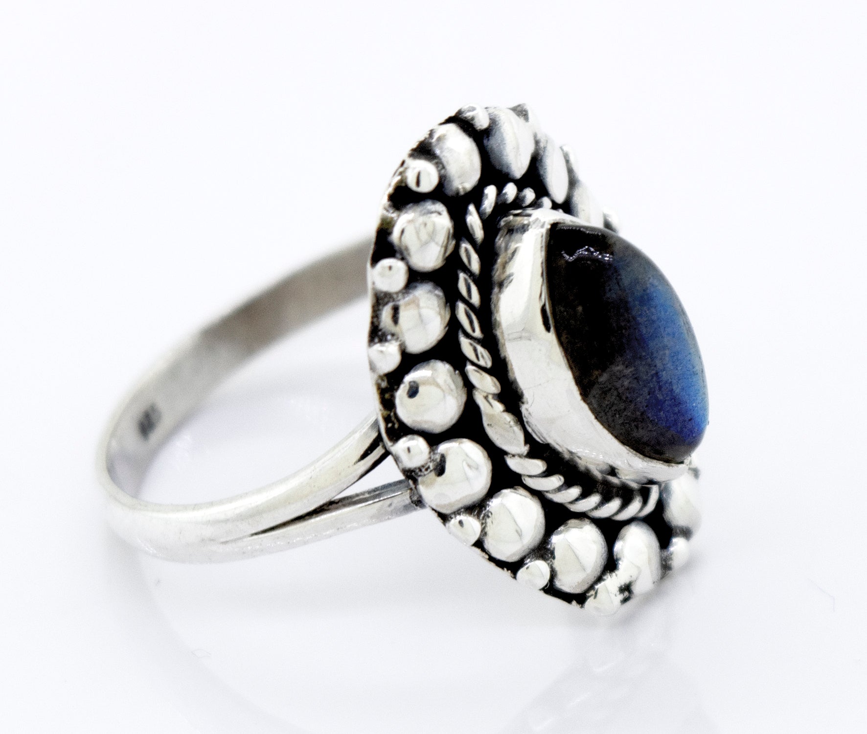 A mesmerizing silver ring featuring the Marquise Shaped Vibrant Labradorite Stone Ring by Super Silver.