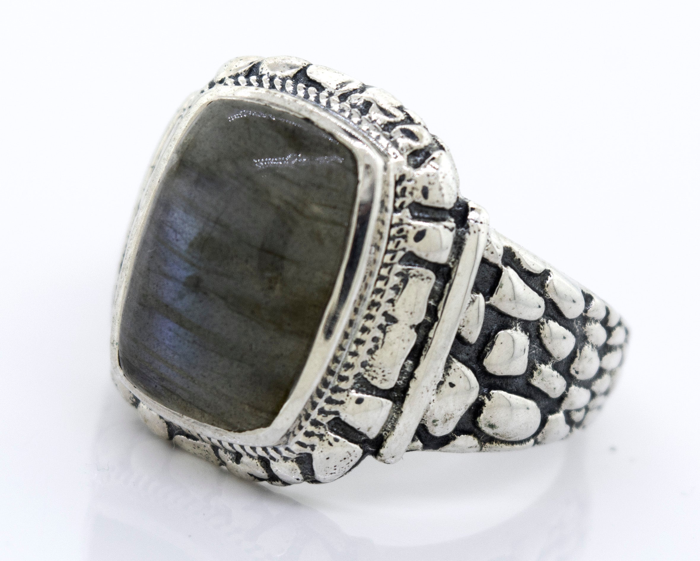 A Labradorite Signet Ring With Dragon Scale Pattern with a labradorite stone.