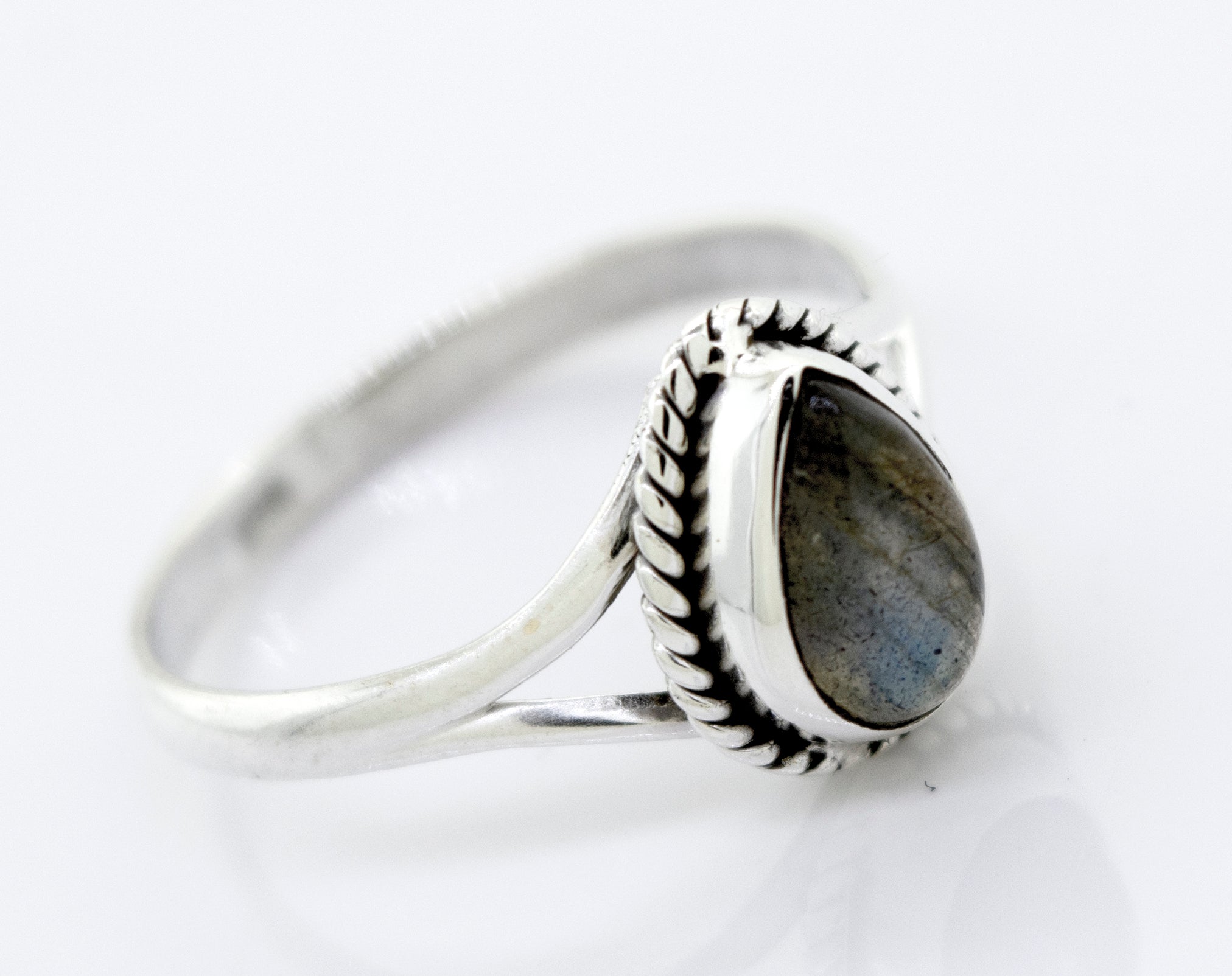 Vibrant Teardrop Shape Stone Ring with a teardrop-shaped gray gemstone set in a detailed band, displayed against a white background.