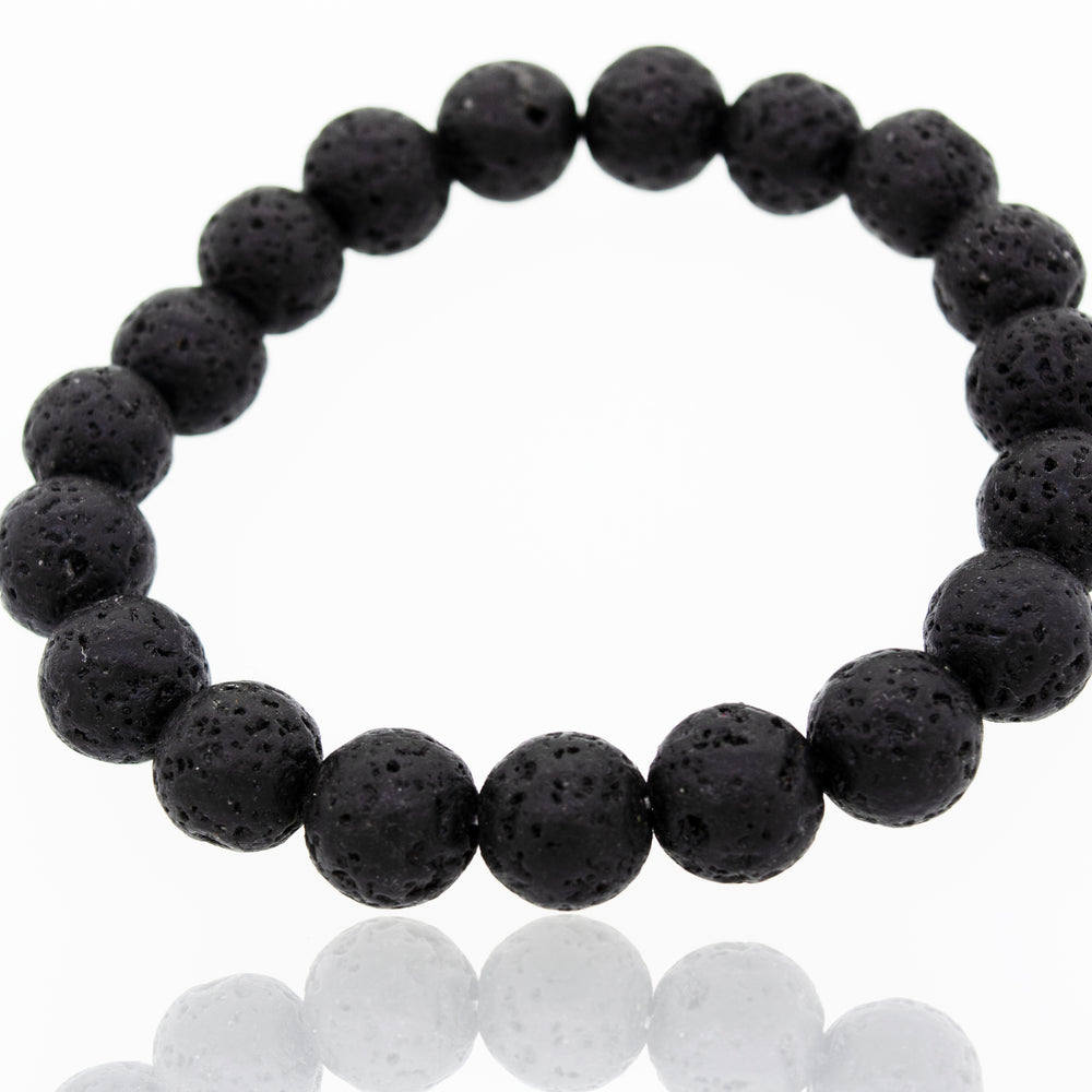 A Super Silver Essential Oil Bracelet with Lava Rock Beads, perfect for lovers of essential oil jewelry, placed on a white surface.