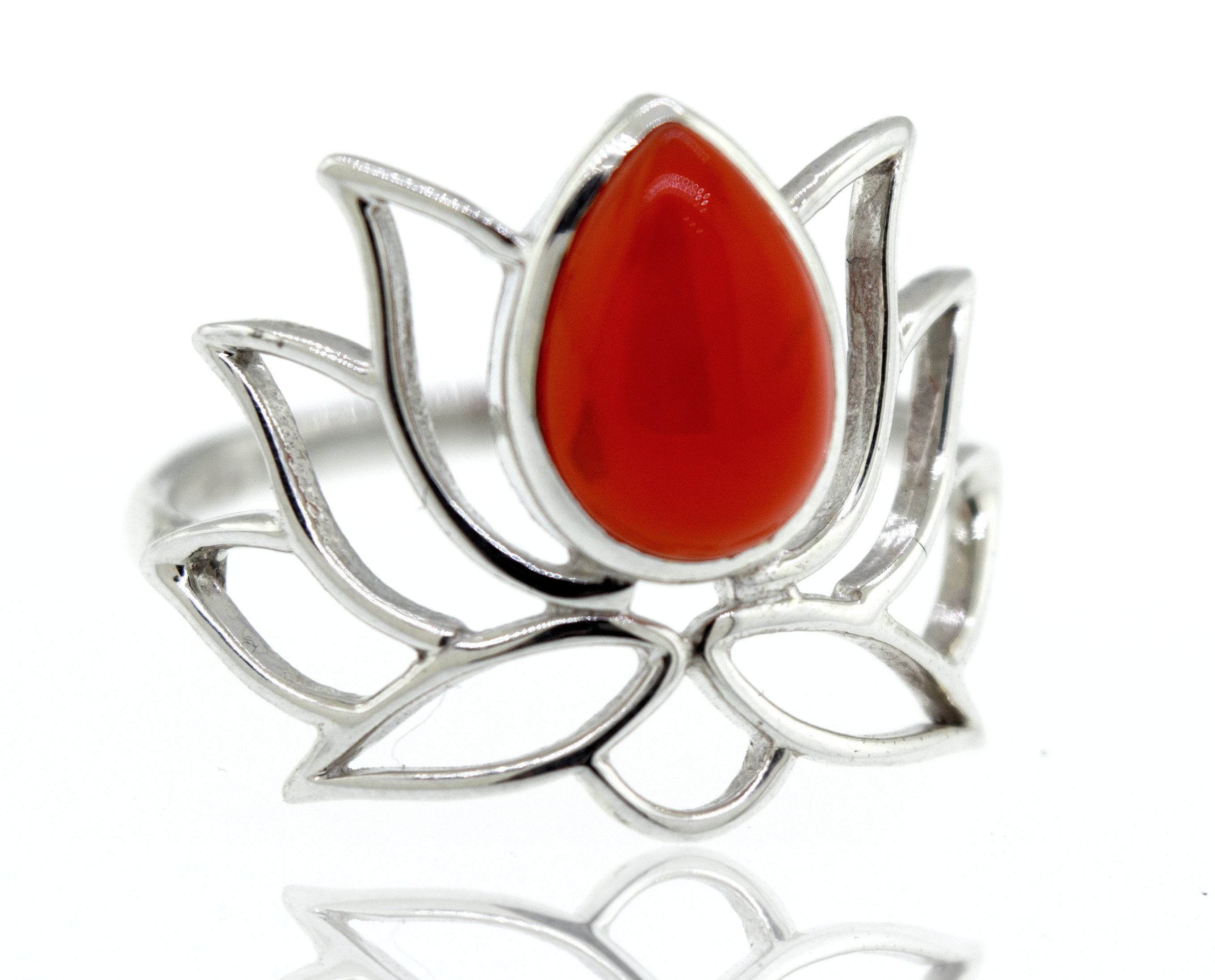 Online Exclusive Teardrop Stone Lotus Ring with a central red teardrop gemstone on a reflective surface.