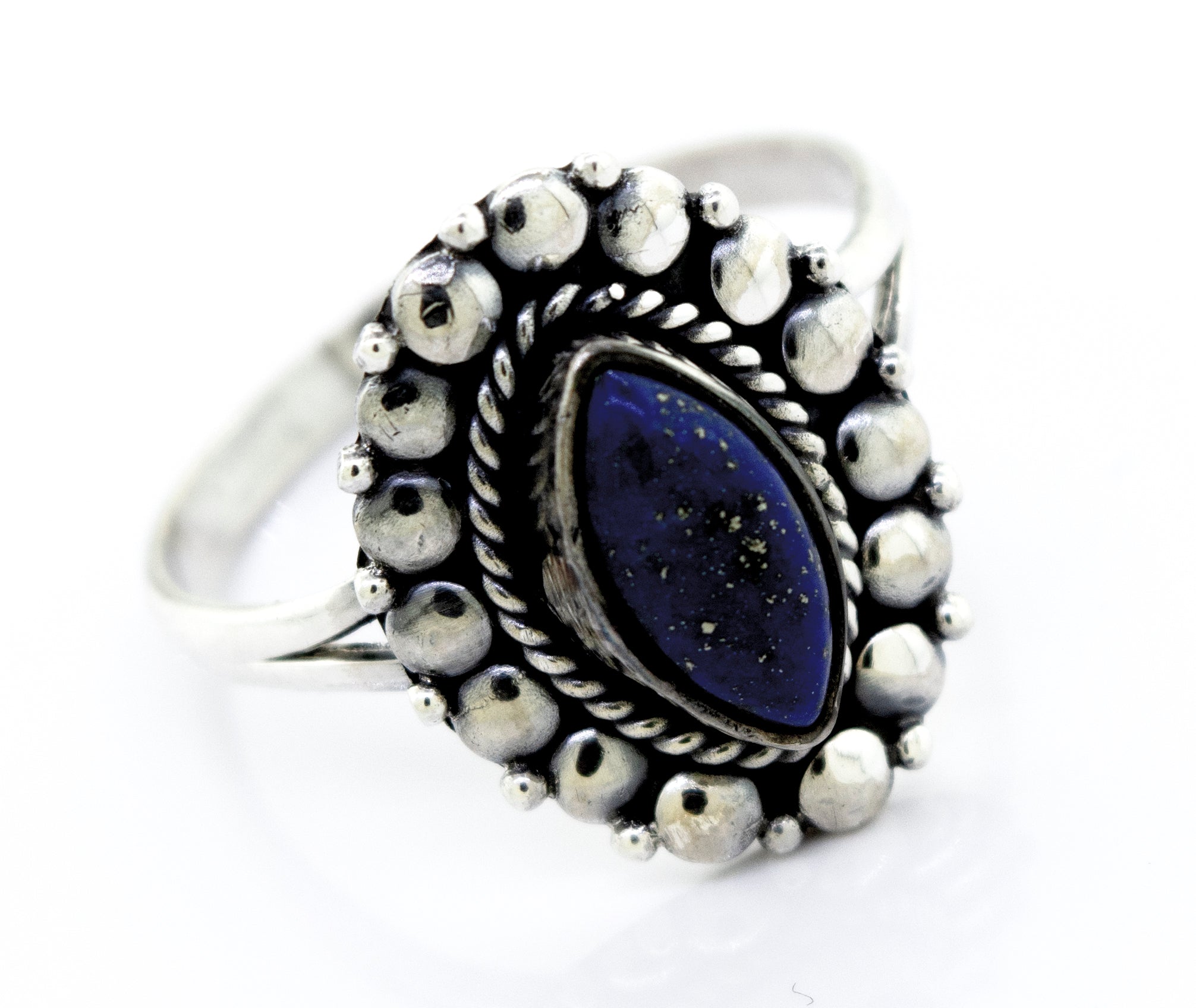 A stunning Super Silver Marquise Shaped Vibrant Lapis Ring with a lapis stone in the center, showcasing a beaded design on the setting.