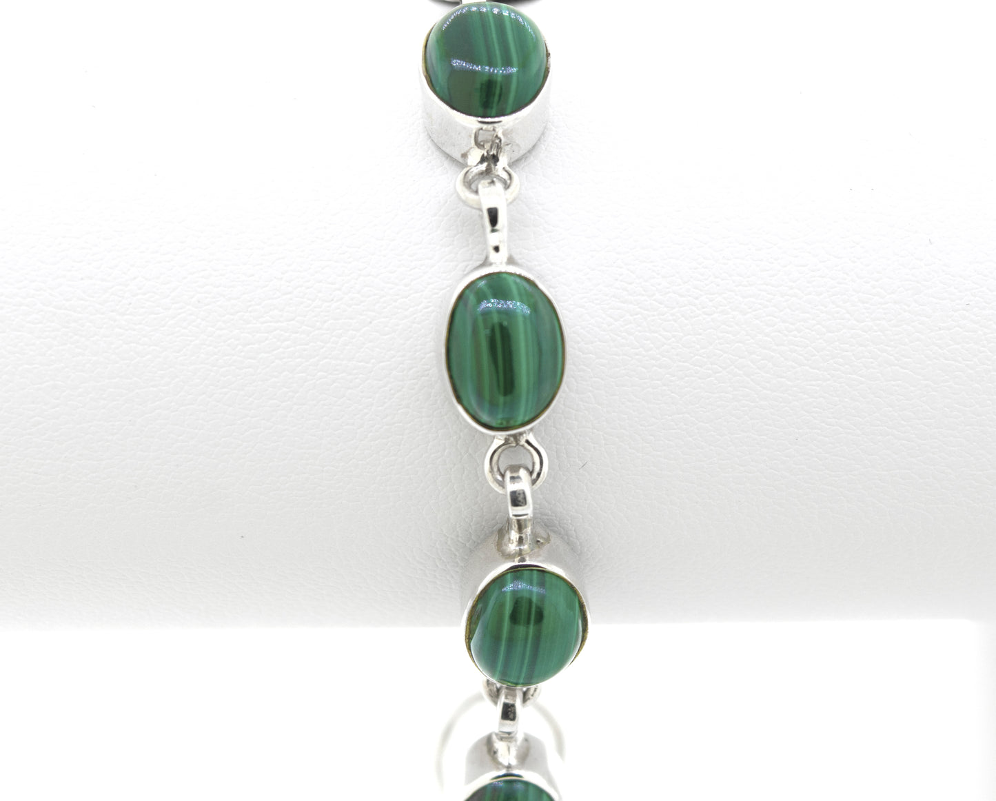 
                  
                    A Super Silver Simple Oval Gemstone Bracelet adorned with stunning green malachite stones.
                  
                