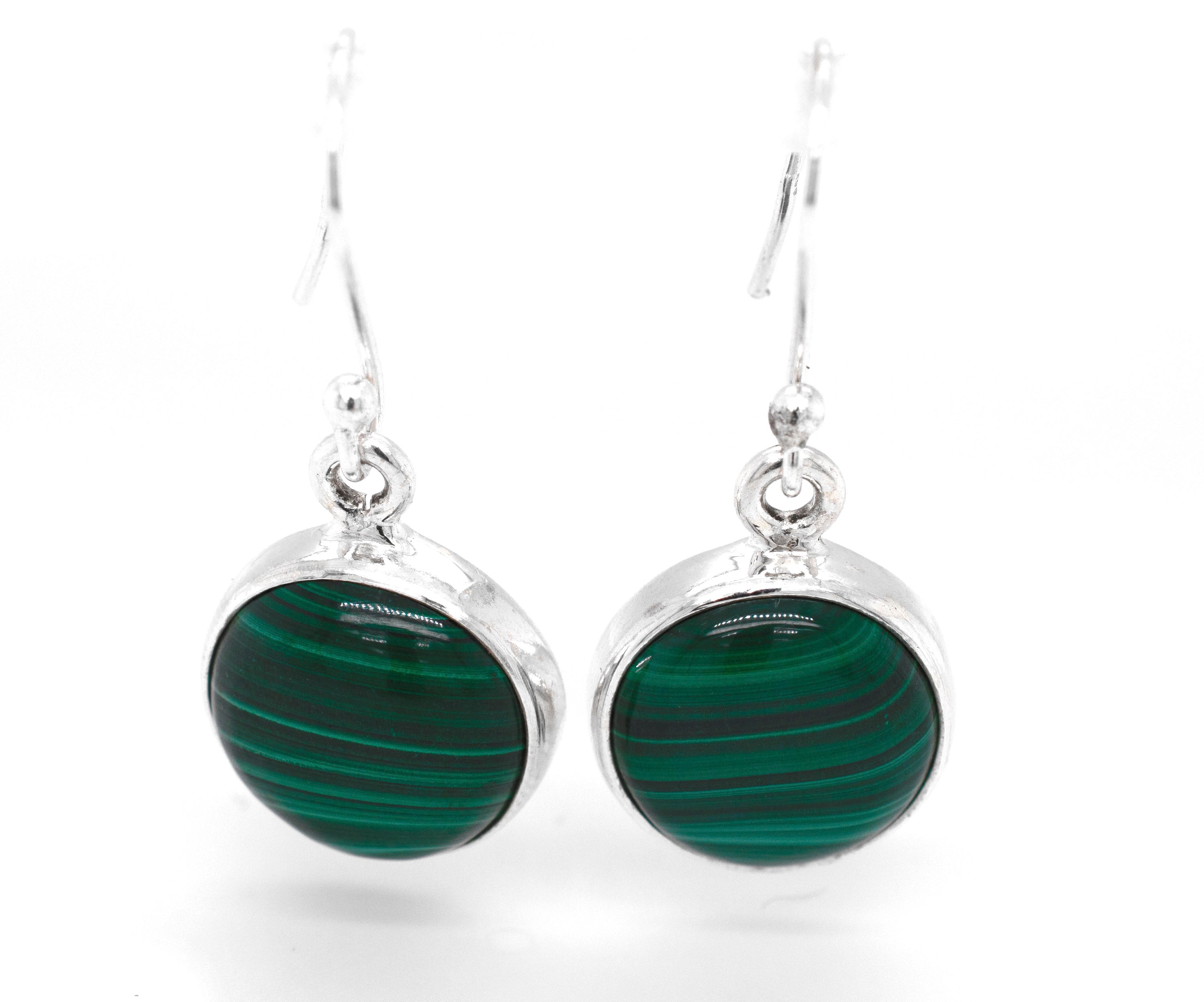 A pair of Super Silver Gorgeous Round Malachite Earrings, known for their healing properties, adorned with beautiful green malachite.