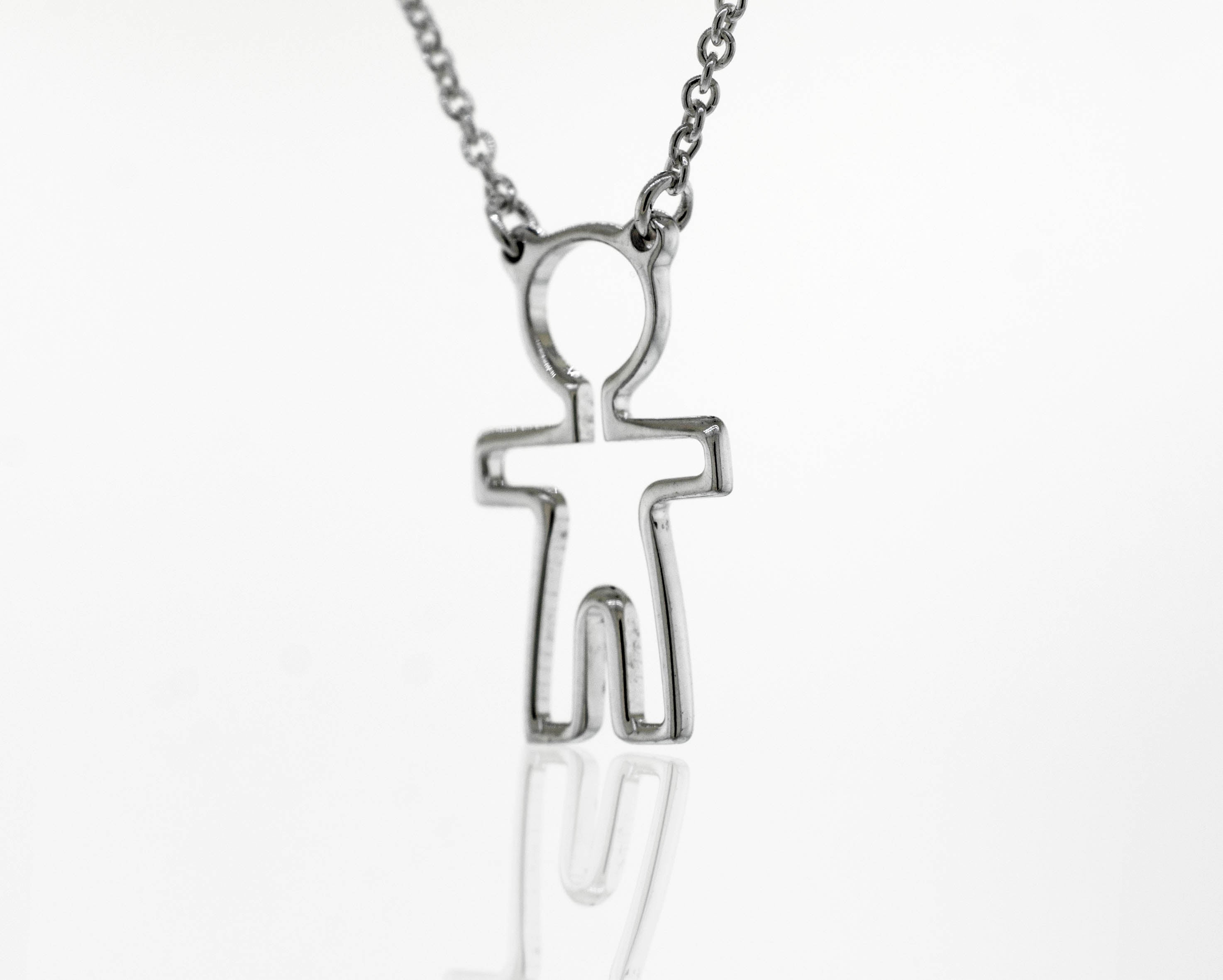 A Super Silver Little Woman Necklace adorned with a delicate figure, symbolizing love and humanity.