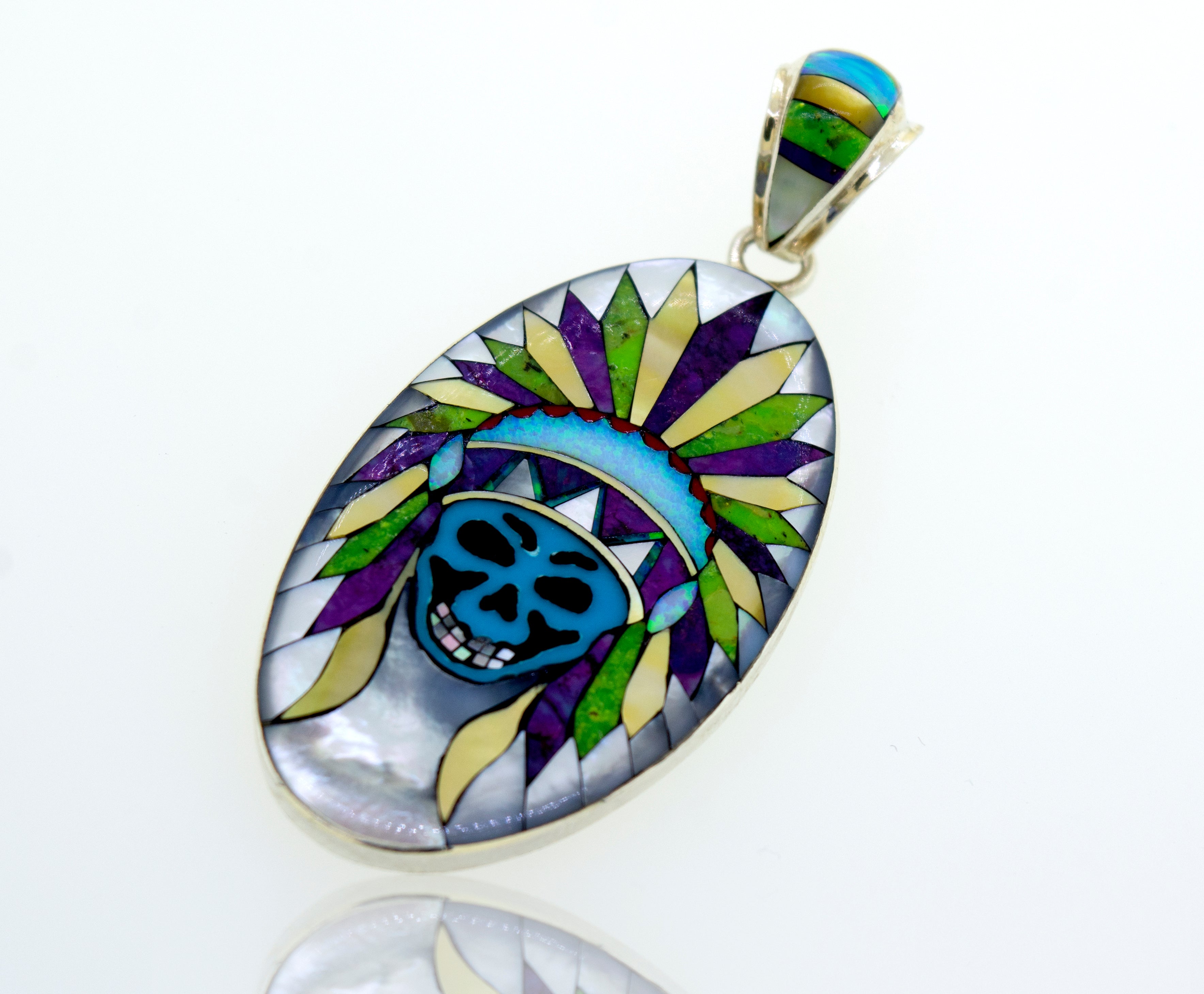 A unique Handcrafted Chief Skull Pendant with a colorful, Super Silver design.