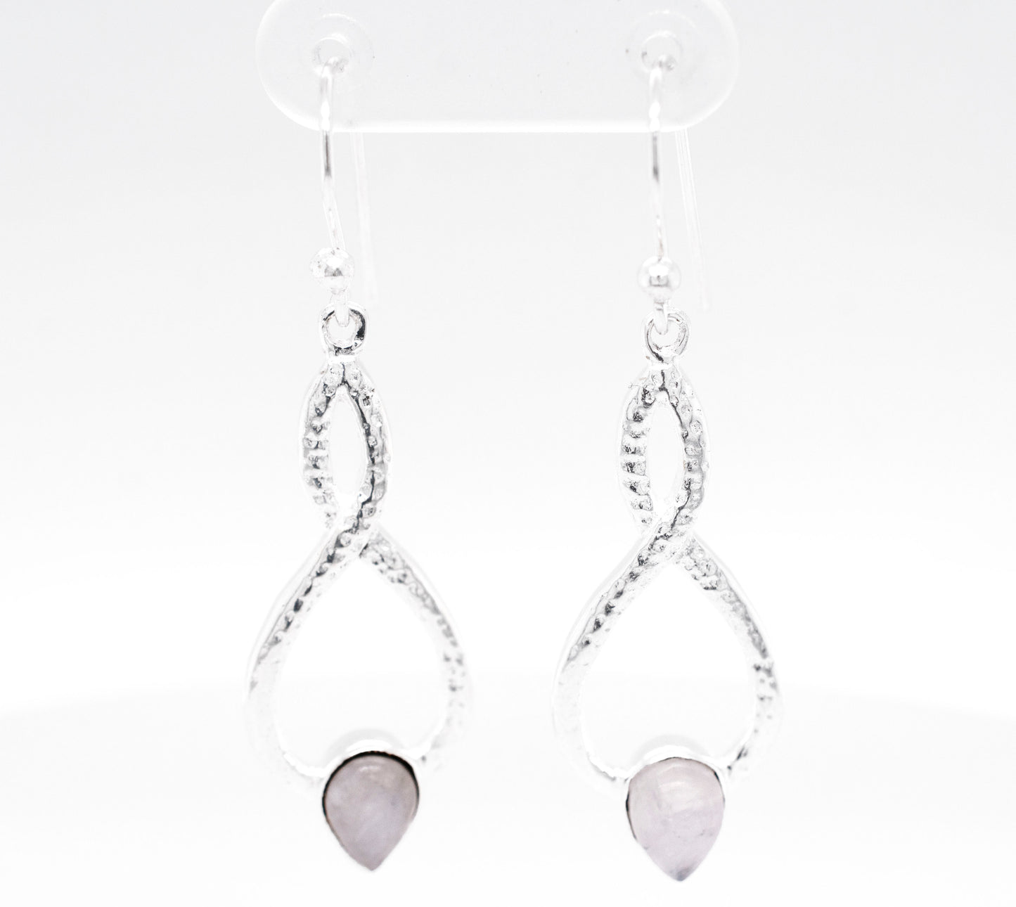 
                  
                    A pair of Super Silver Chic Moonstone Teardrop Earrings with a pink stone.
                  
                