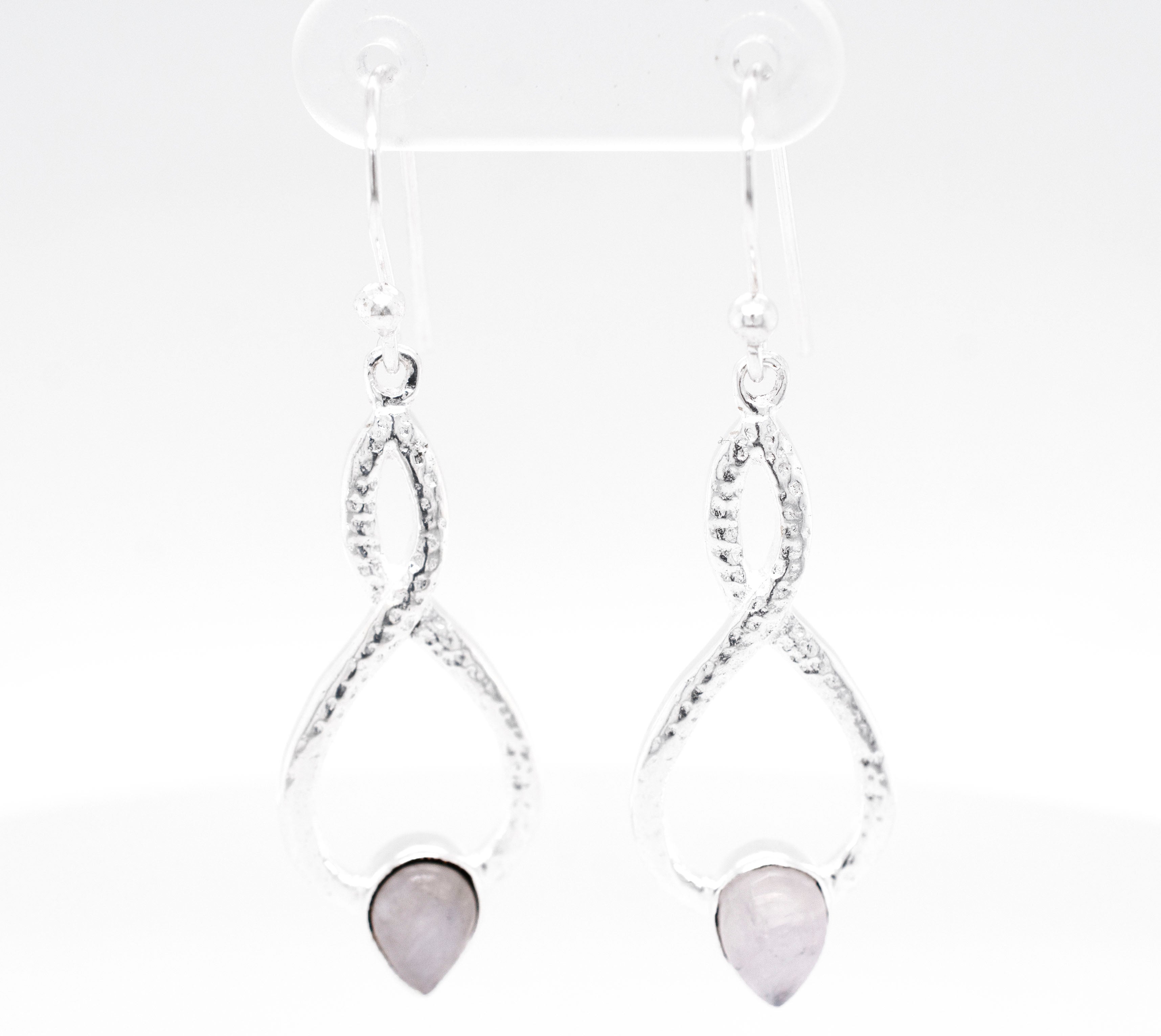 A pair of Super Silver Chic Moonstone Teardrop Earrings with a pink stone.
