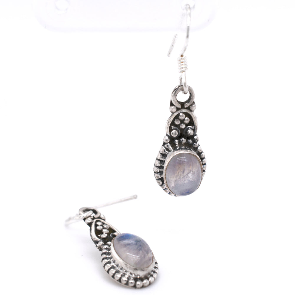 
                  
                    Dainty Bali Style Moonstone Earrings with a blue moonstone, by Super Silver.
                  
                