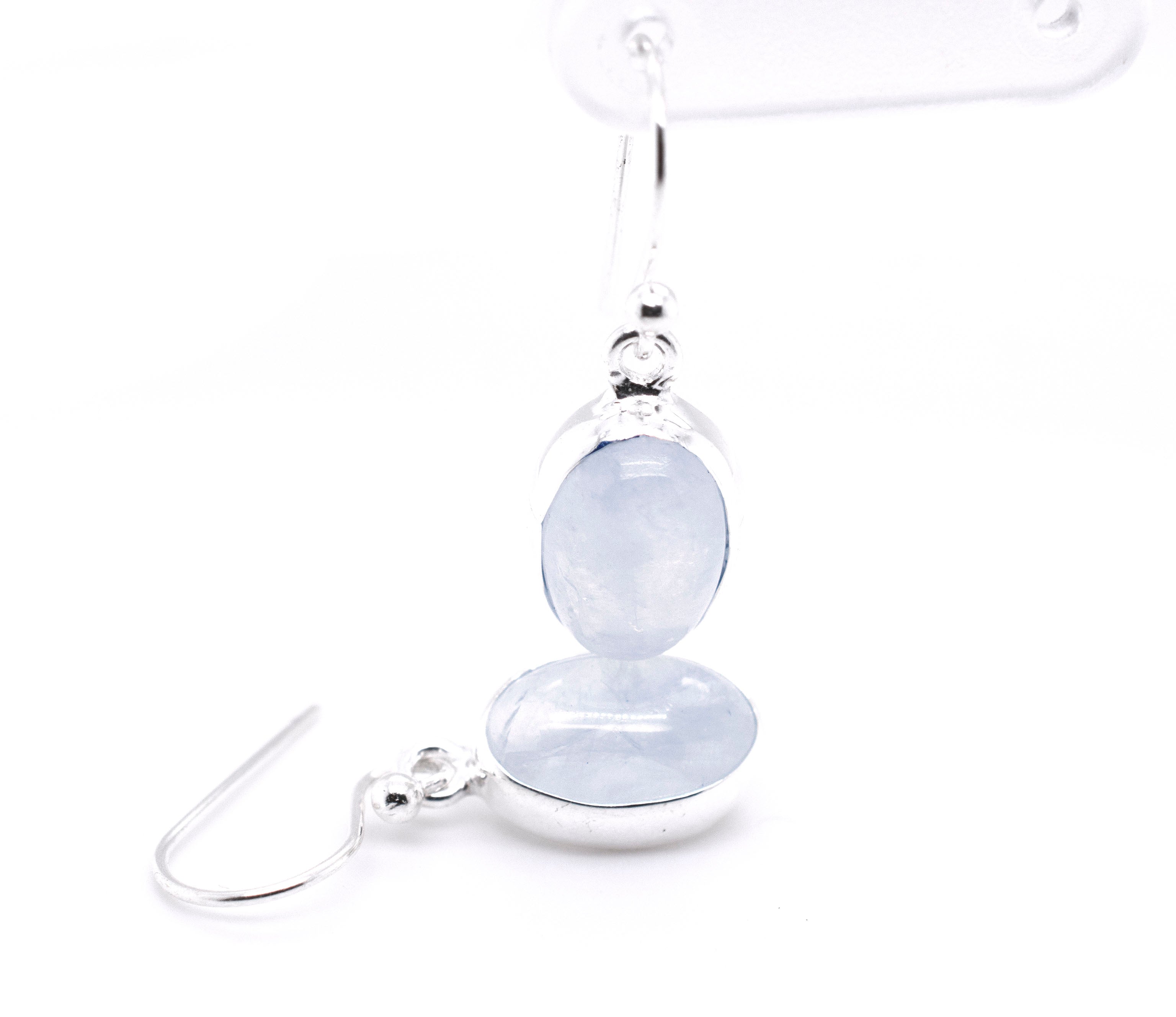A pair of Simple Oval Moonstone Earrings by Super Silver with a blue quartz stone.