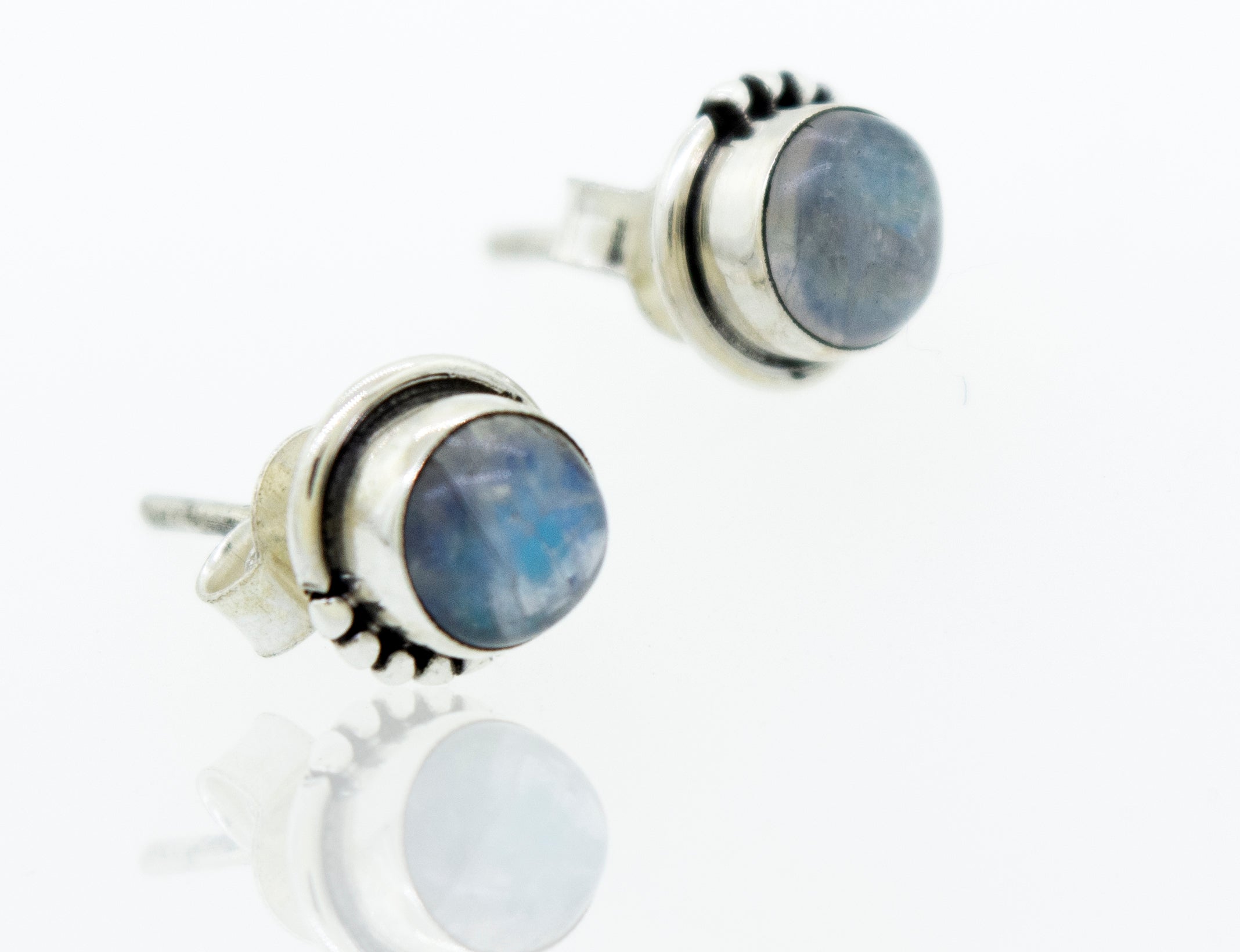 A pair of Super Silver Small Moonstone Studs with Ball Border earrings with a dainty 7mm blue stone.