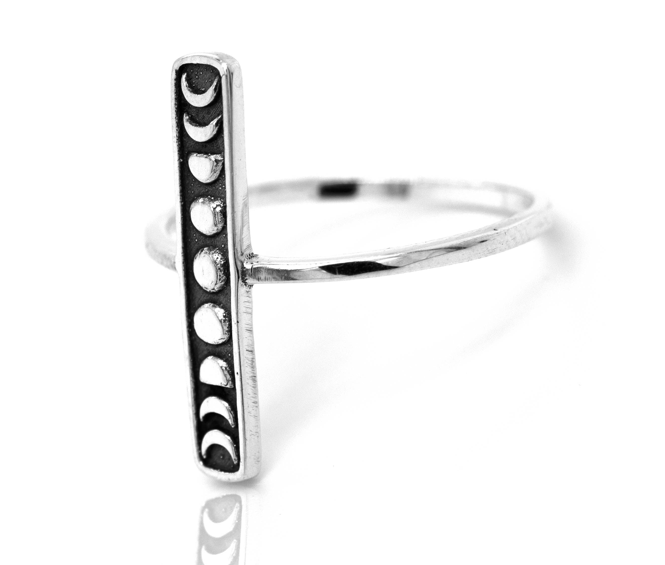 A minimalist Elongated Moon Phases ring.