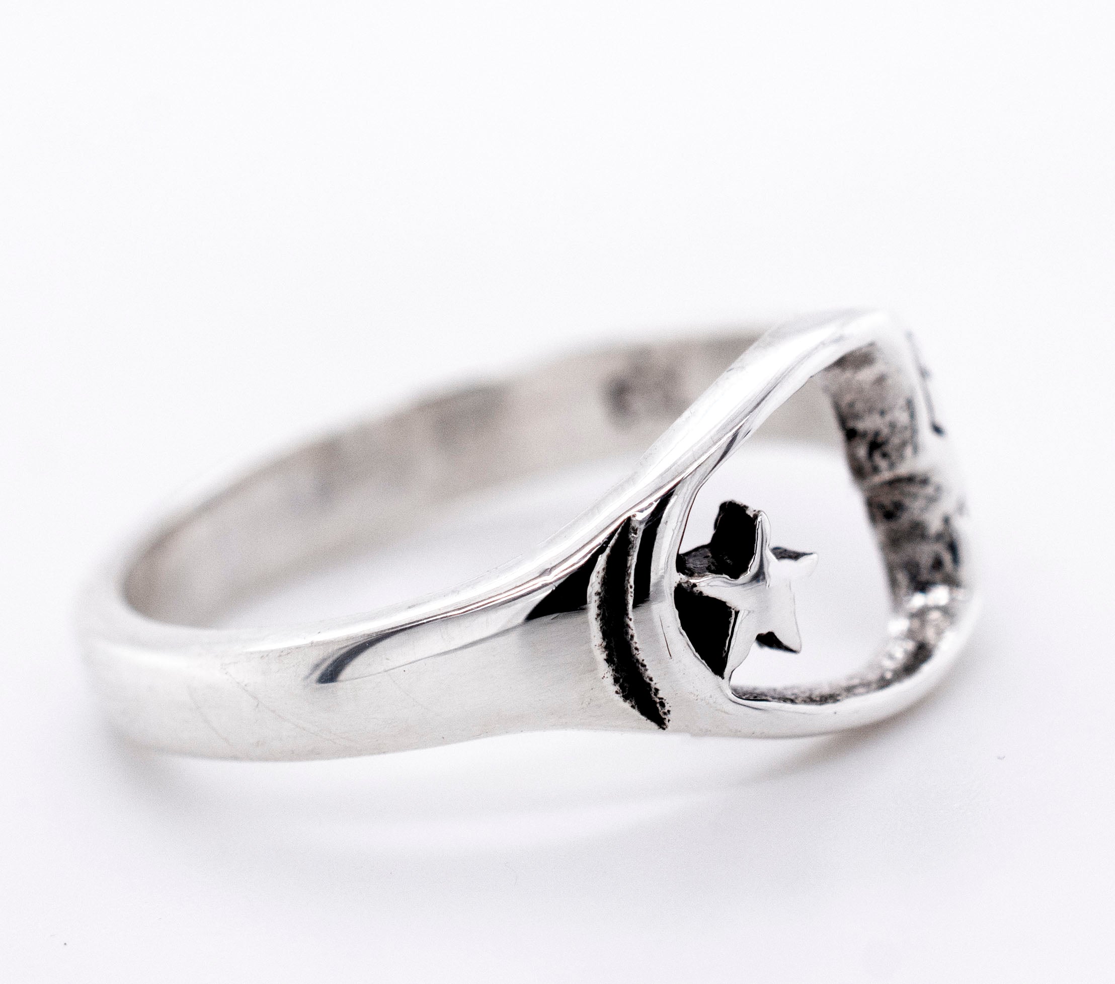 A Crescent Moon With Face And Star Ring, perfect for everyday wear, from Super Silver.