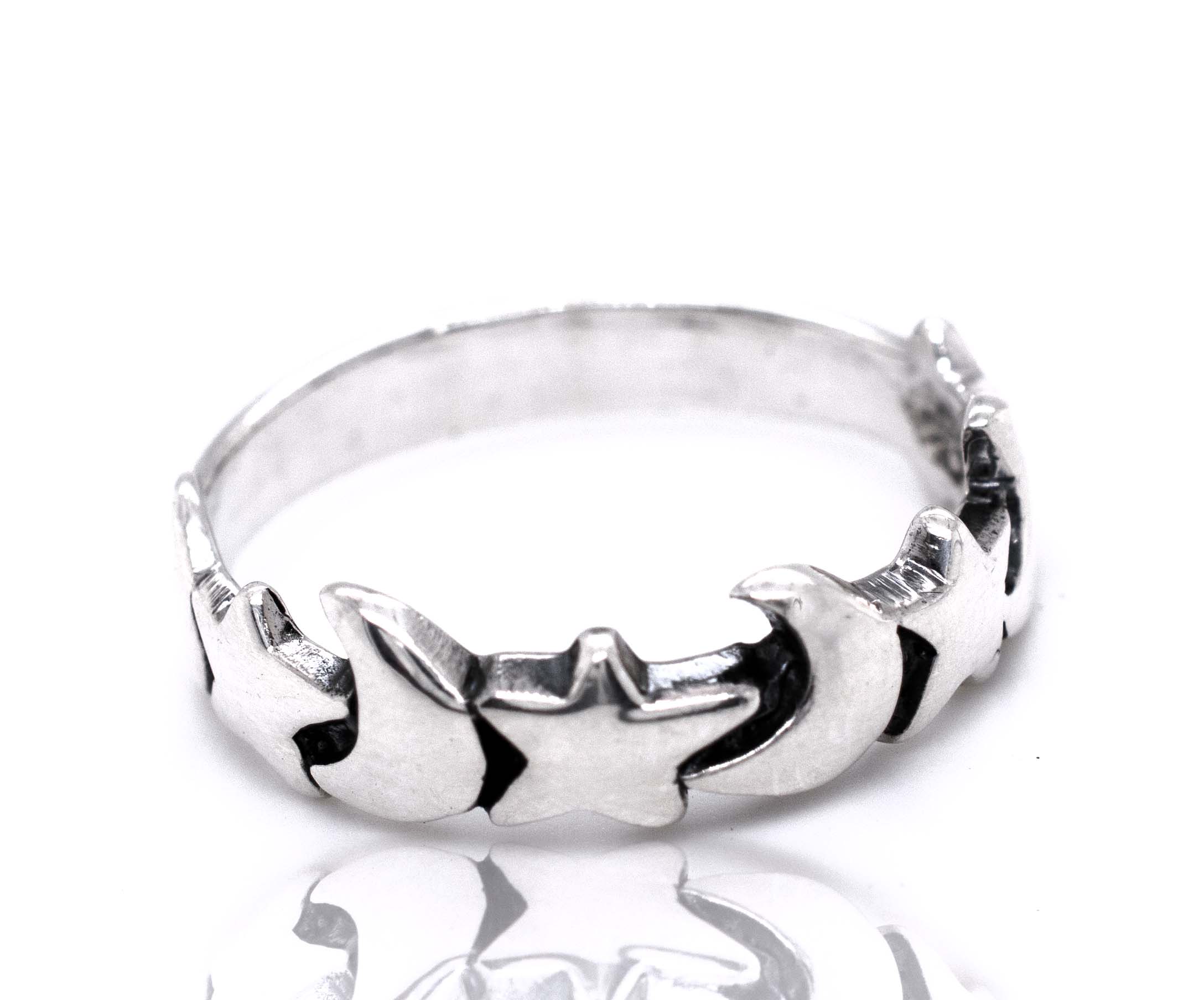A Crescent Moon And Star Band with a star design from Super Silver.