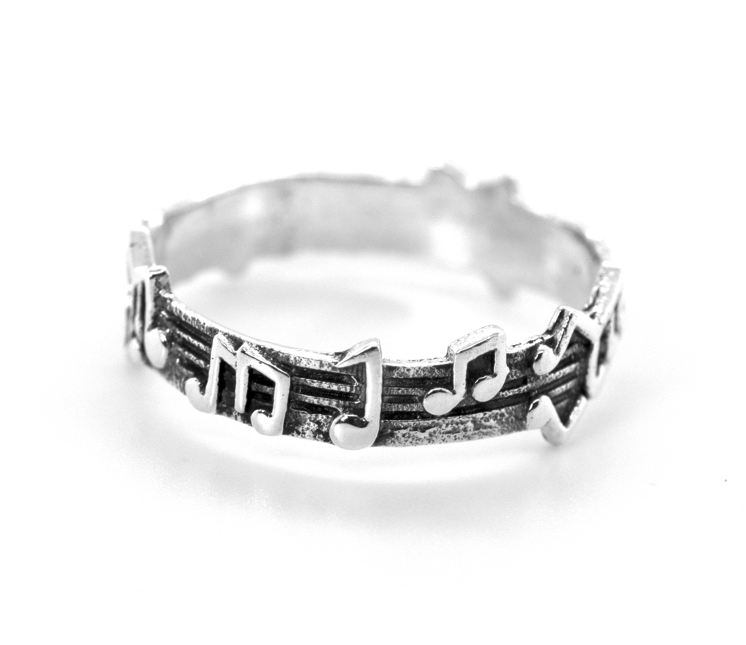 A Super Silver sterling silver band with a music notes design.