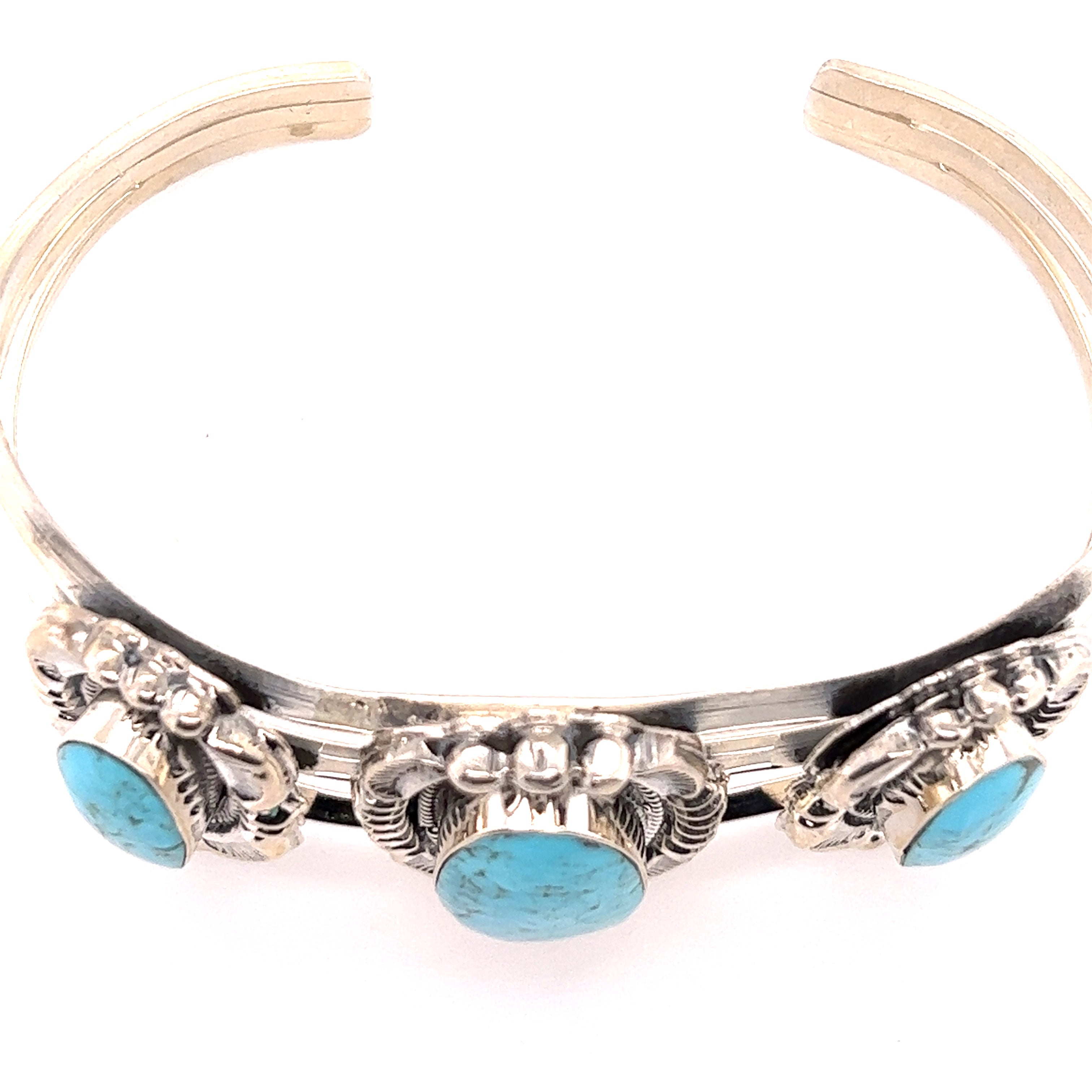 A stunning Super Silver Native American Cuff with Three Stunning Turquoise Stones bracelet.