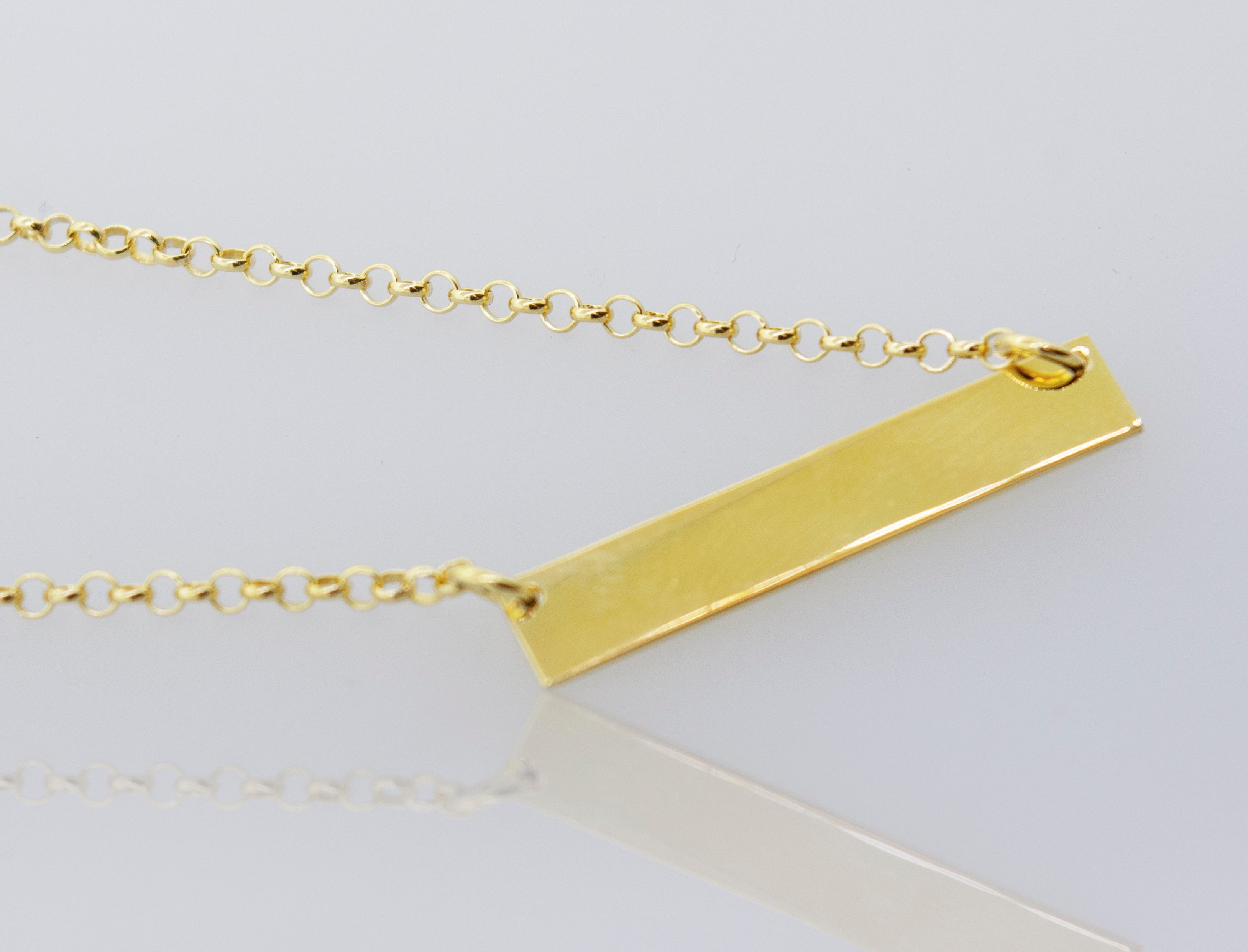 A Super Silver Dainty Nameplate Necklace on a white background.