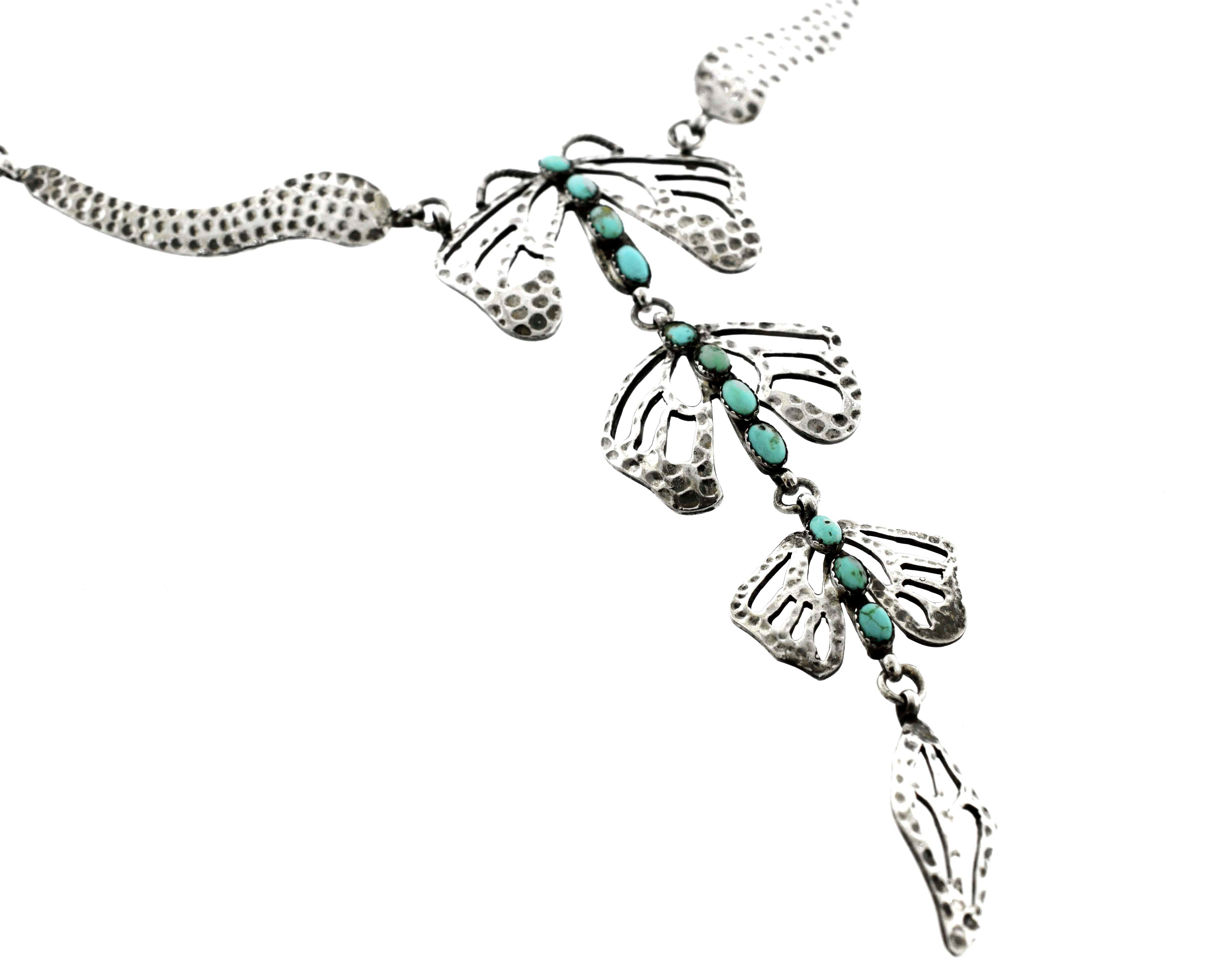A handmade Turquoise Dragonfly Necklace And Earring Set with Super Silver dragonfly charm and leaf accents.