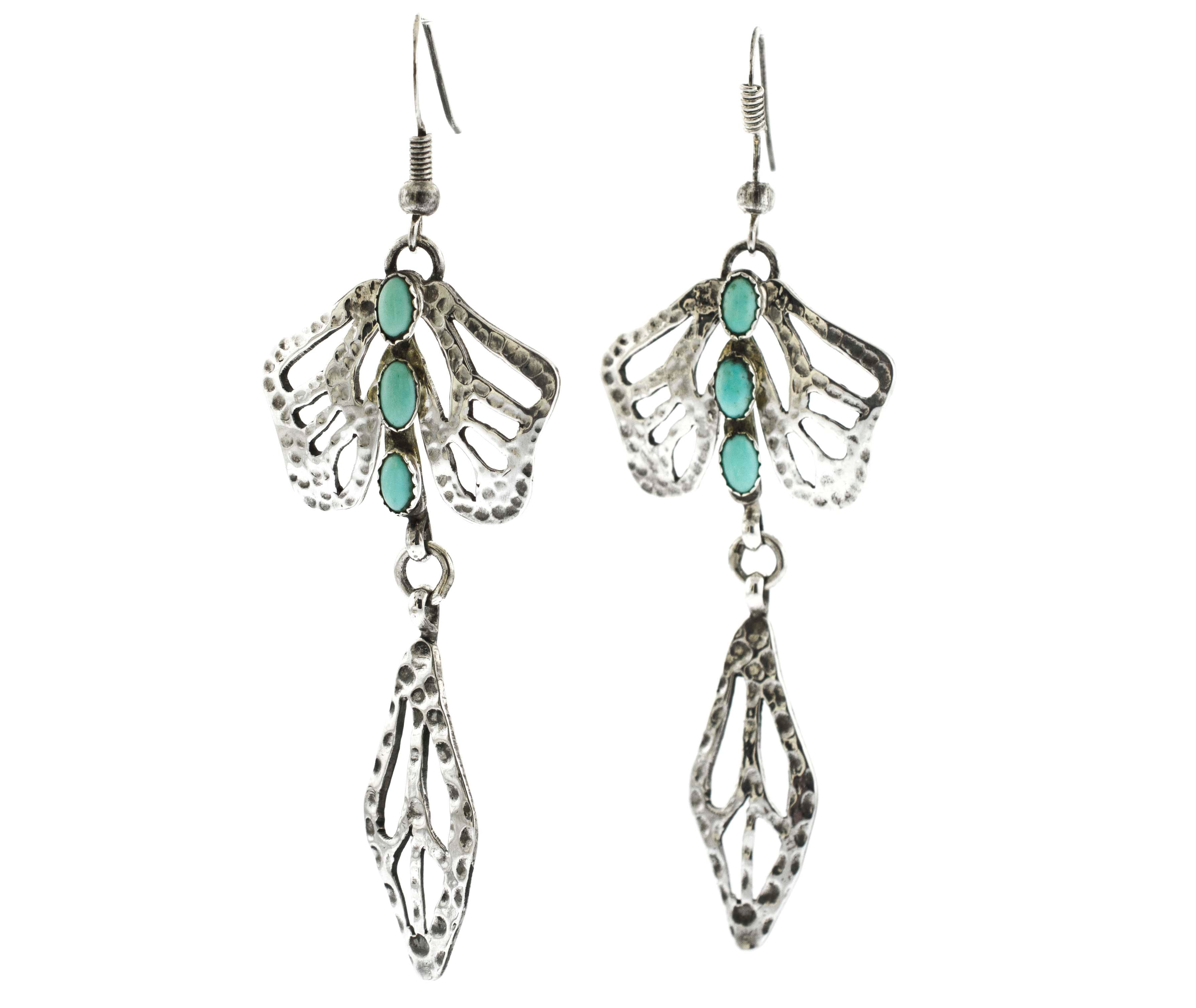 A pair of Handmade Turquoise Dragonfly earrings from Super Silver.