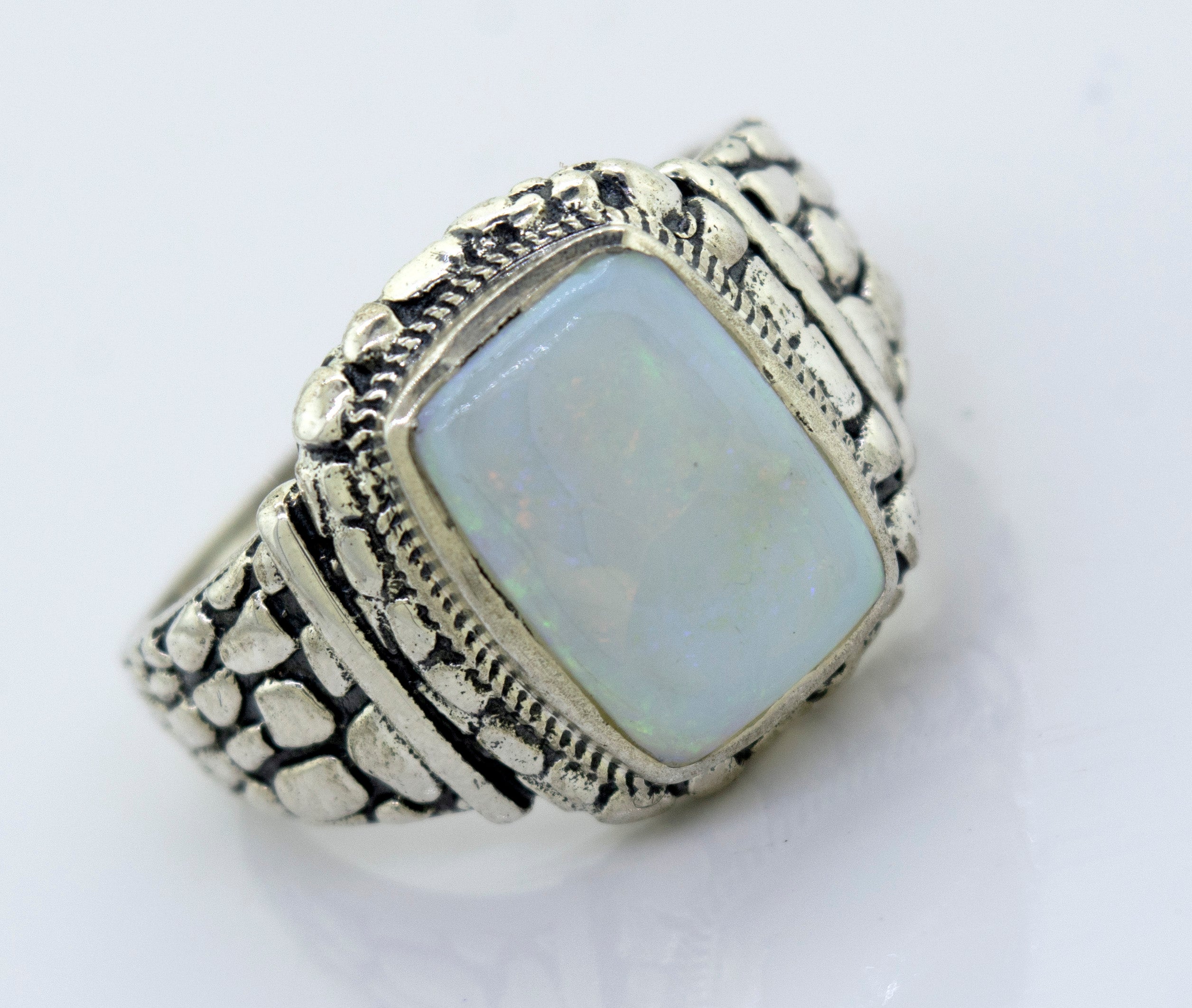 A minimalist sterling silver ring with an Australian Opal Signet Ring With Dragon Scale Pattern stone.