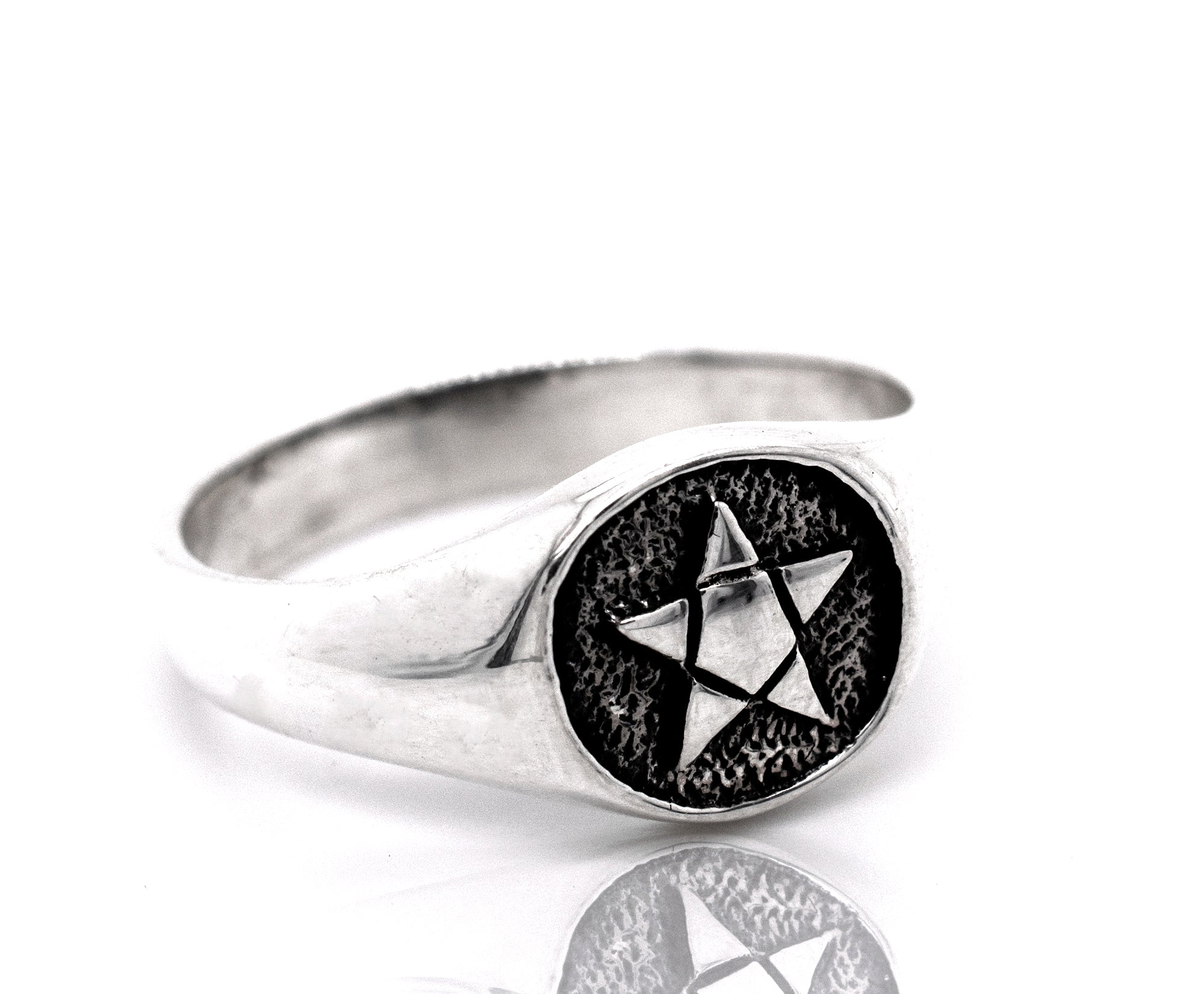 A gothic silver Pentagram Ring with a star on it.
