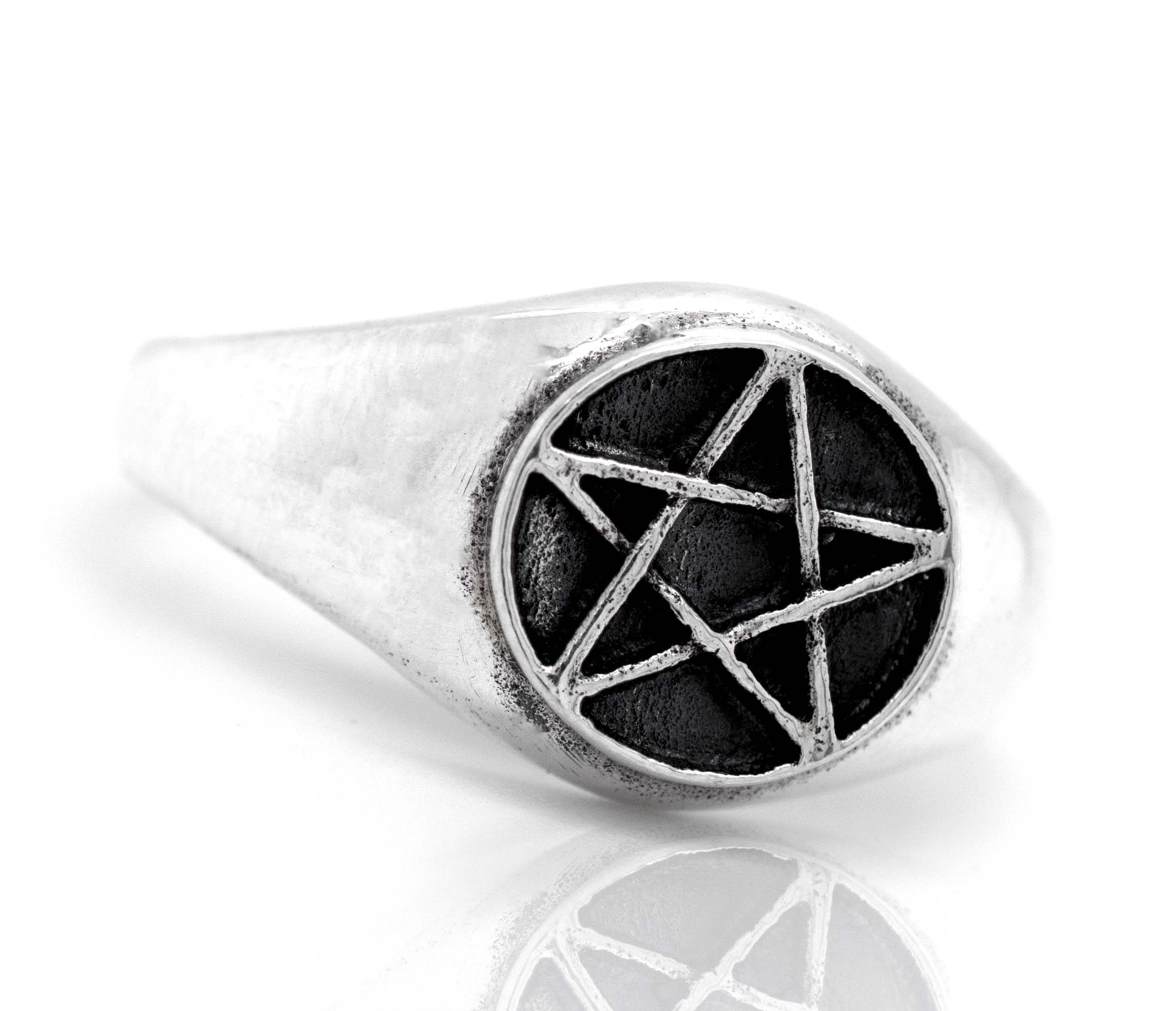 A gothic silver Pentagram Ring with a pentagram star on it.