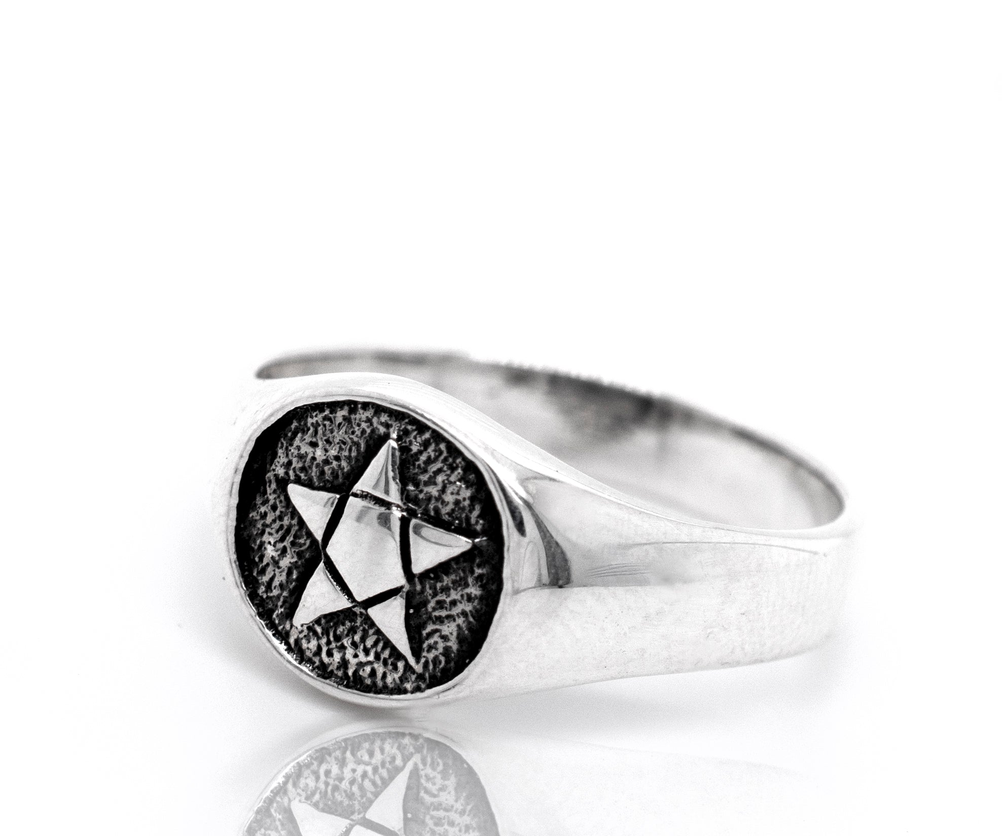 A sterling silver Pentagram Ring with a star on it.
