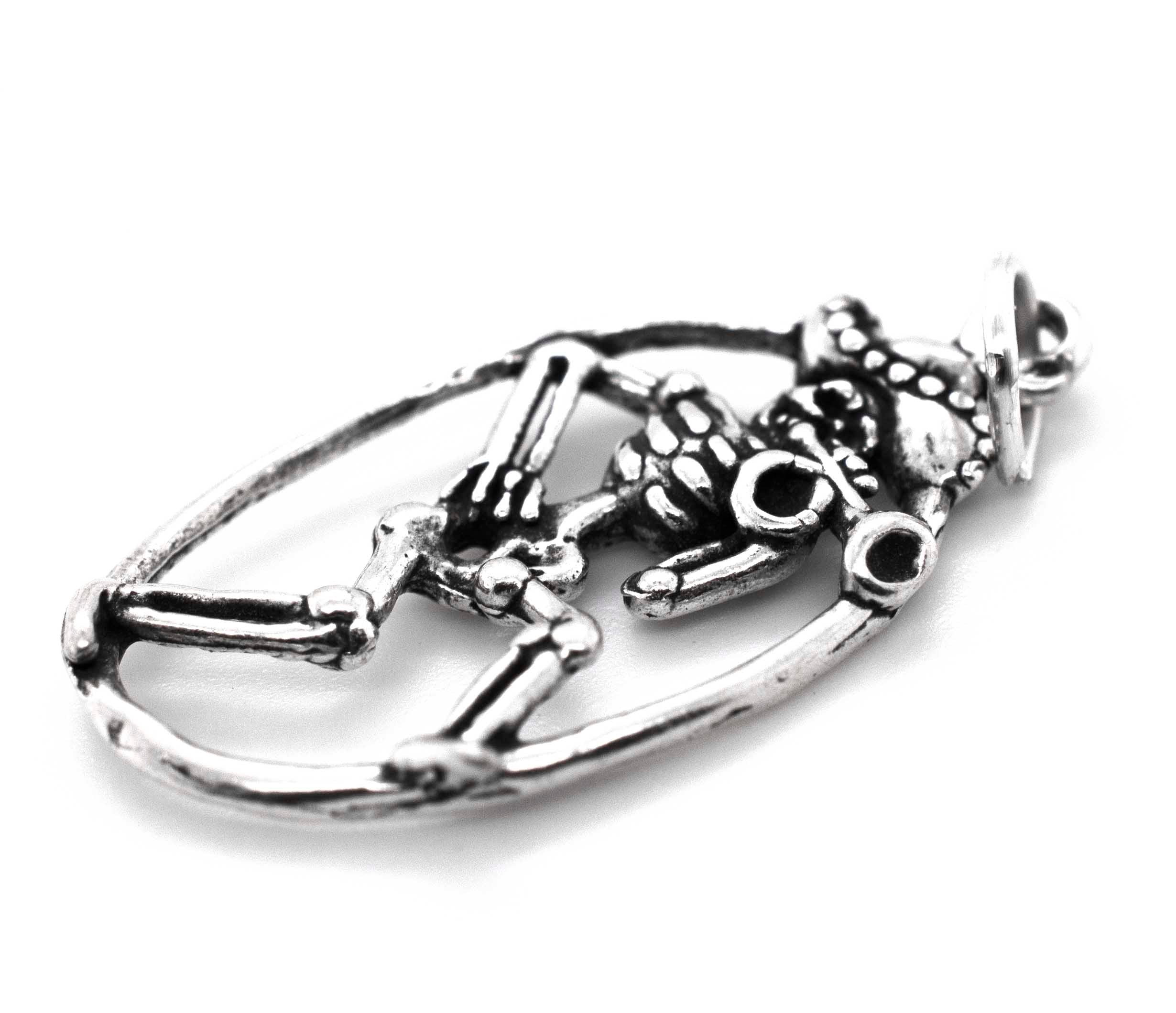 A Super Silver Mariachi Skeleton with Horn Pendant featuring a mariachi skeleton encased within it.