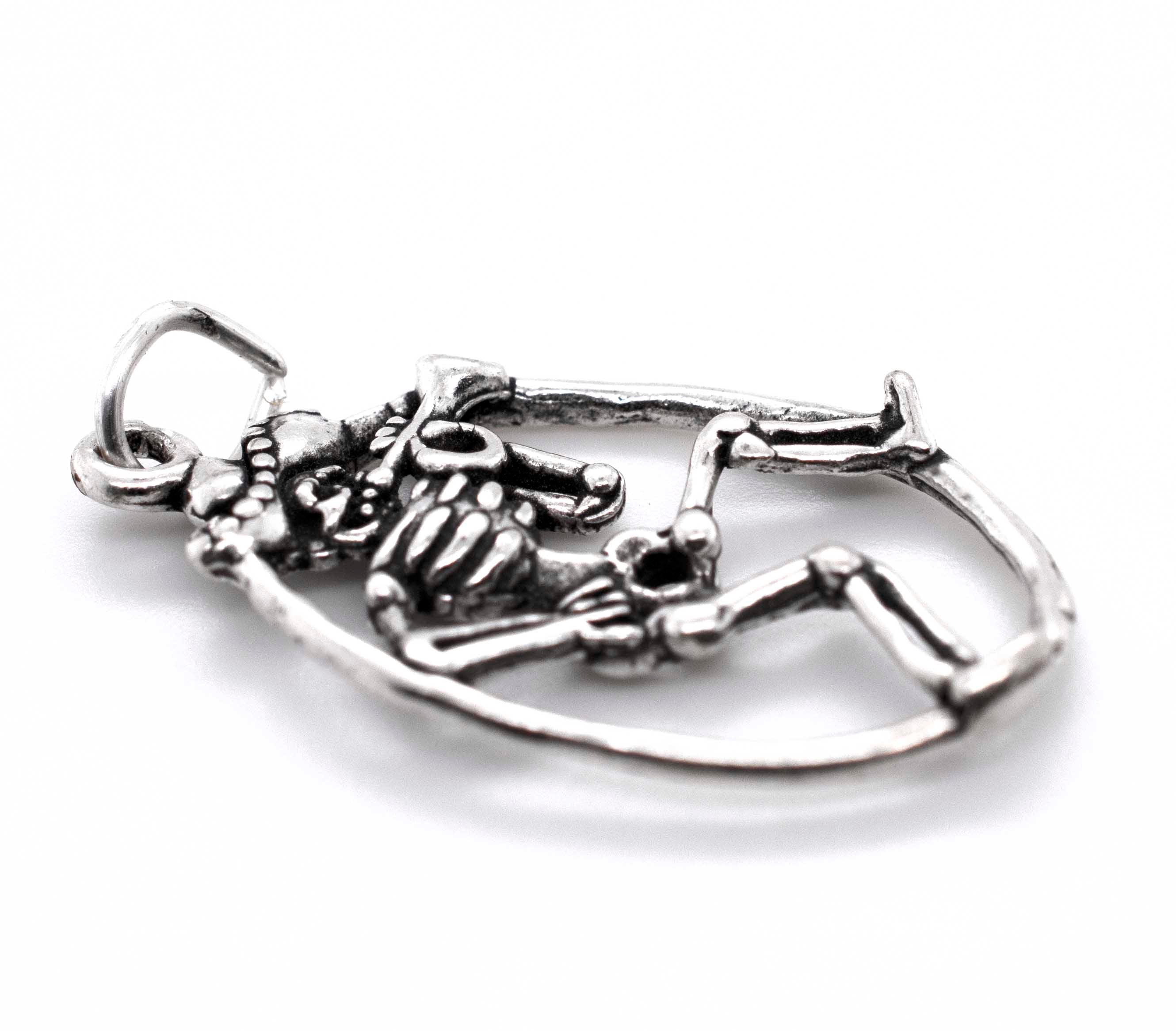 A Mariachi Skeleton with Horn pendant from Super Silver, on a white background, perfect for a Día De Los Muertos or charm bracelet accessory.
