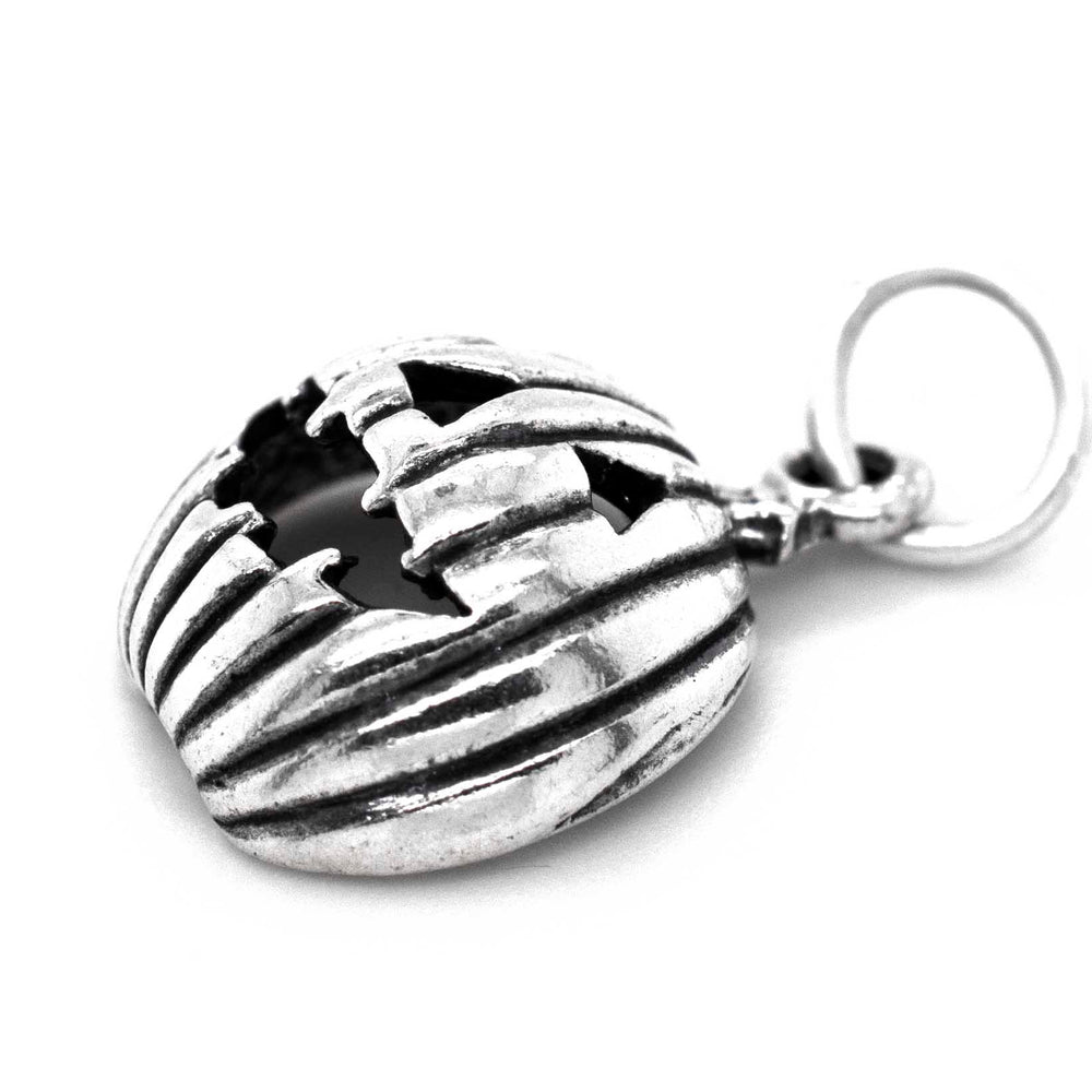 A Super Silver Grinning Jack O' Lantern Charm pendant, perfect for Halloween.