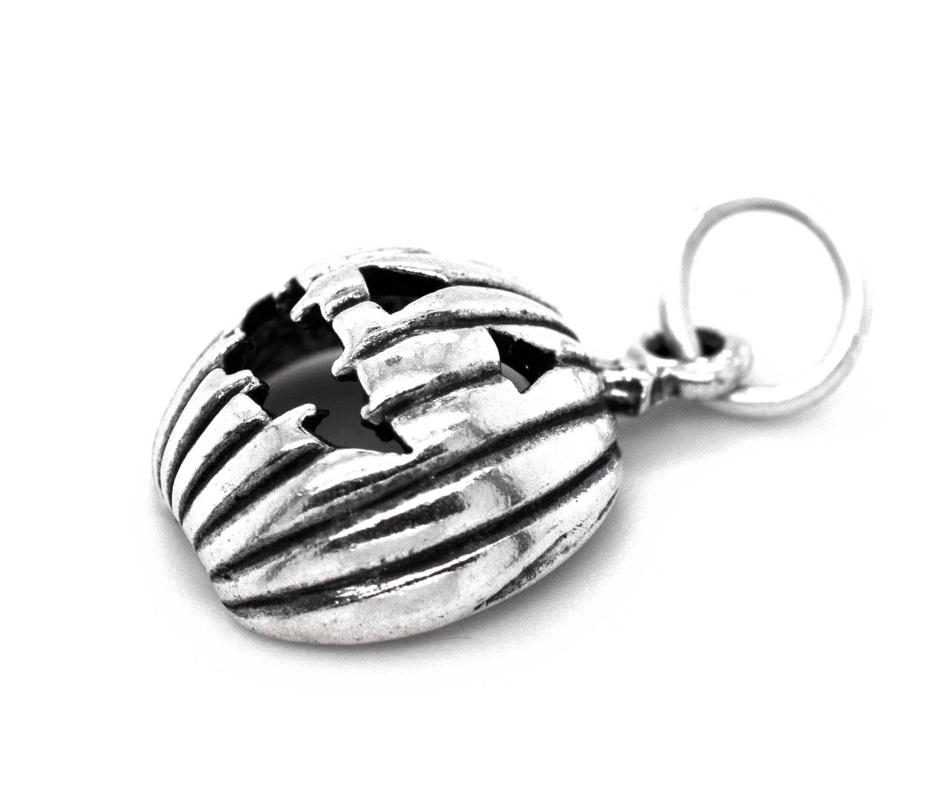 A Super Silver Grinning Jack O' Lantern Charm pendant, perfect for Halloween.