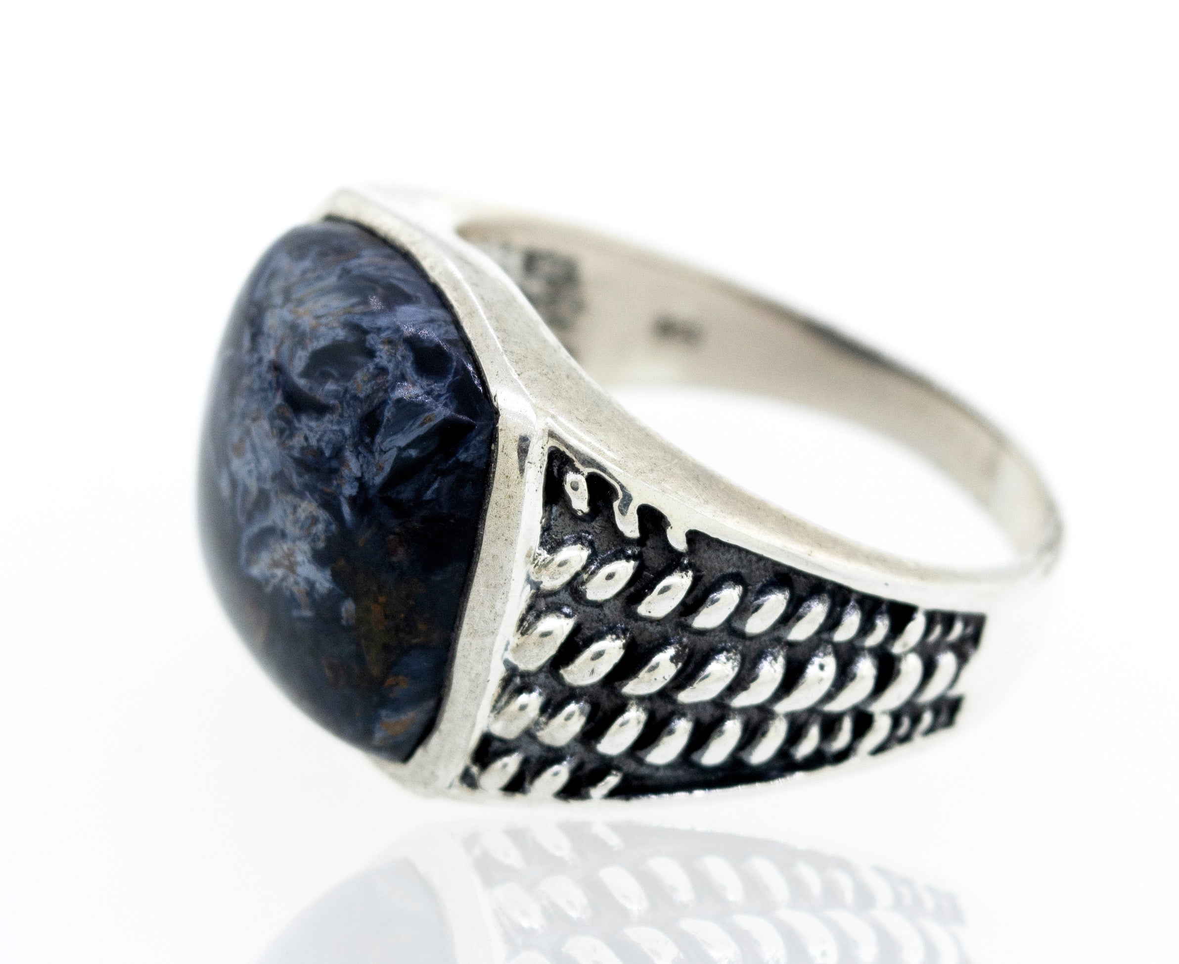 A Pietersite signet ring with a rope design.