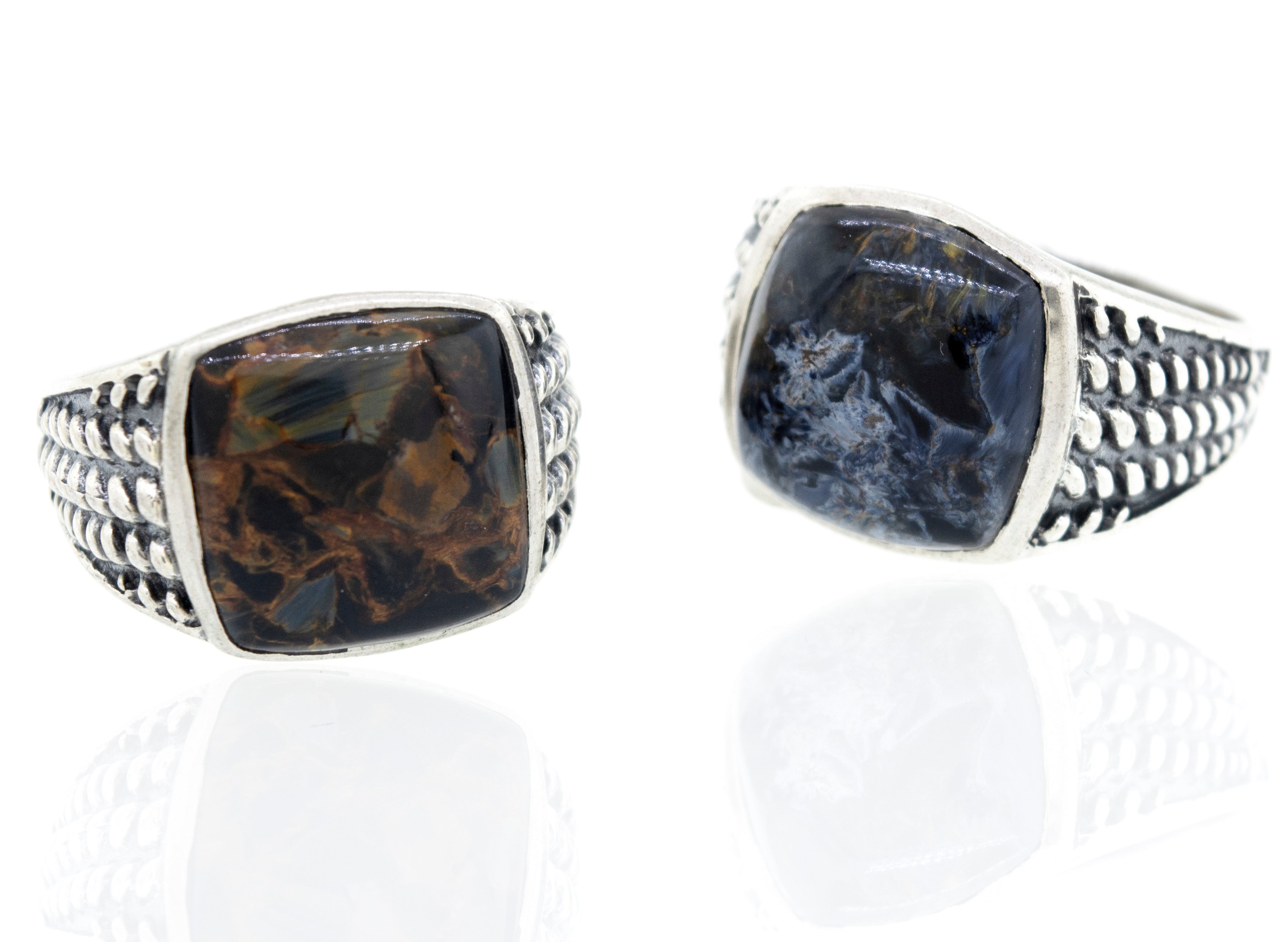 A minimalist pair of Pietersite Signet Rings with black and brown stones.
