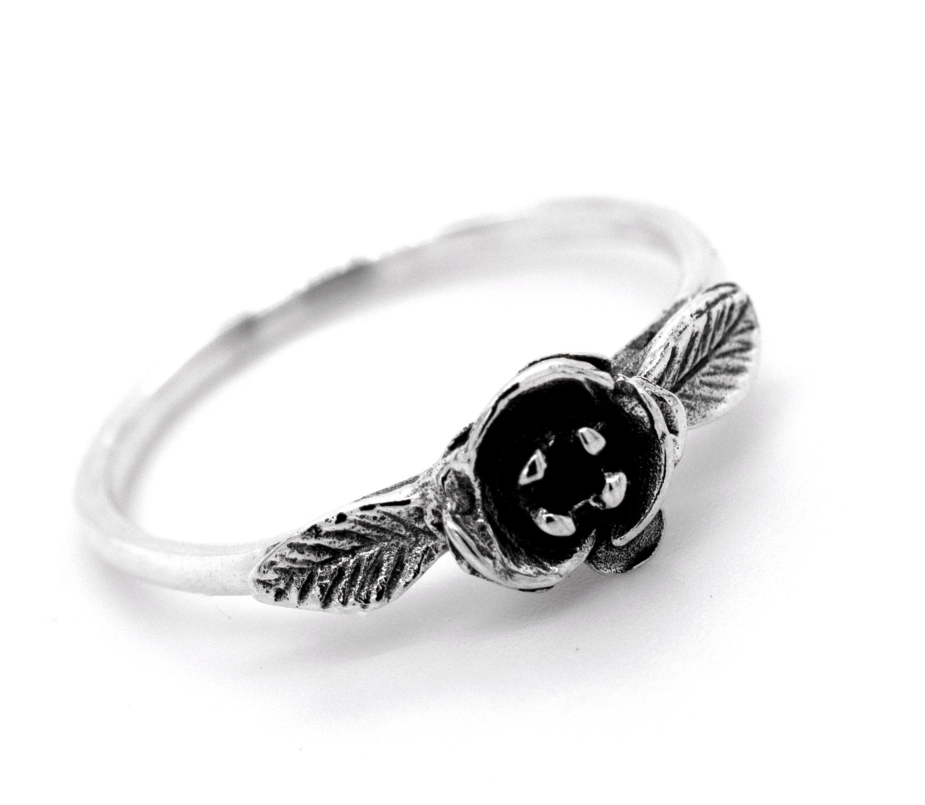A boho-inspired silver Fashionable Rose Ring adorned with a stunning black rose and delicate leaves, capturing the essence of Santa Cruz's enchanting nature.