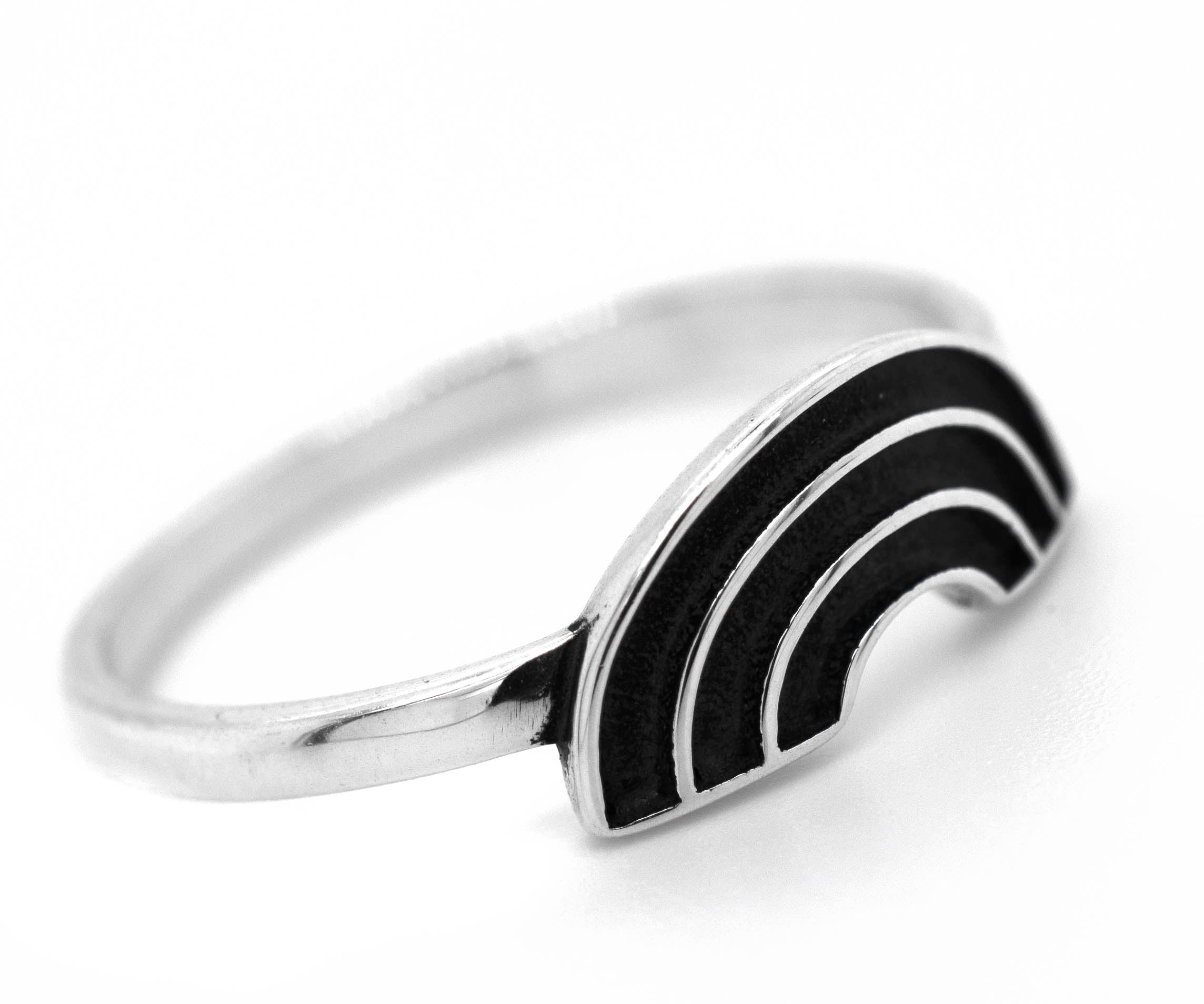 A Super Silver rainbow ring with black and white stripes, representing love and friendship through diversity.