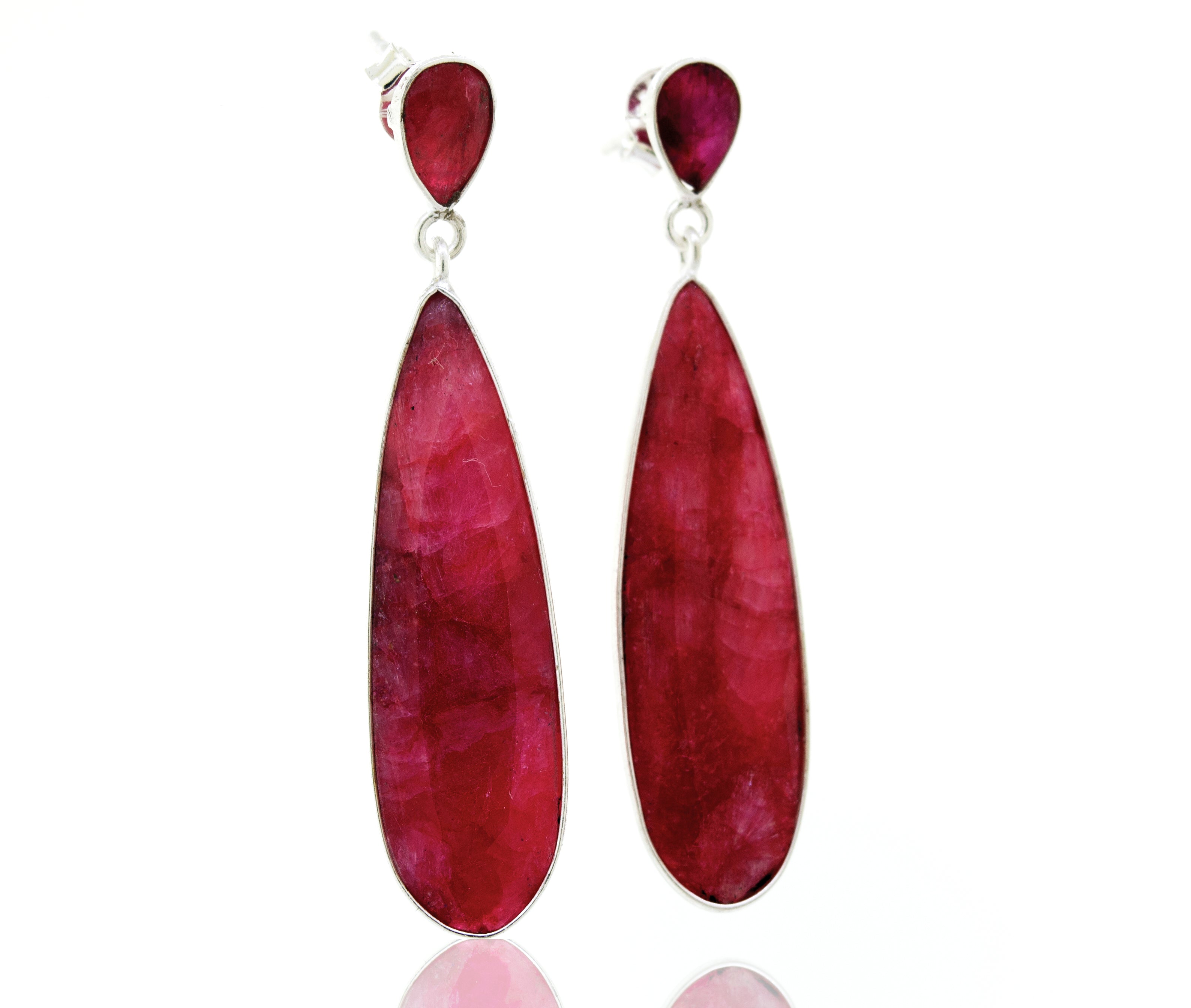 A pair of Super Silver vibrant teardrop shape ruby earrings.